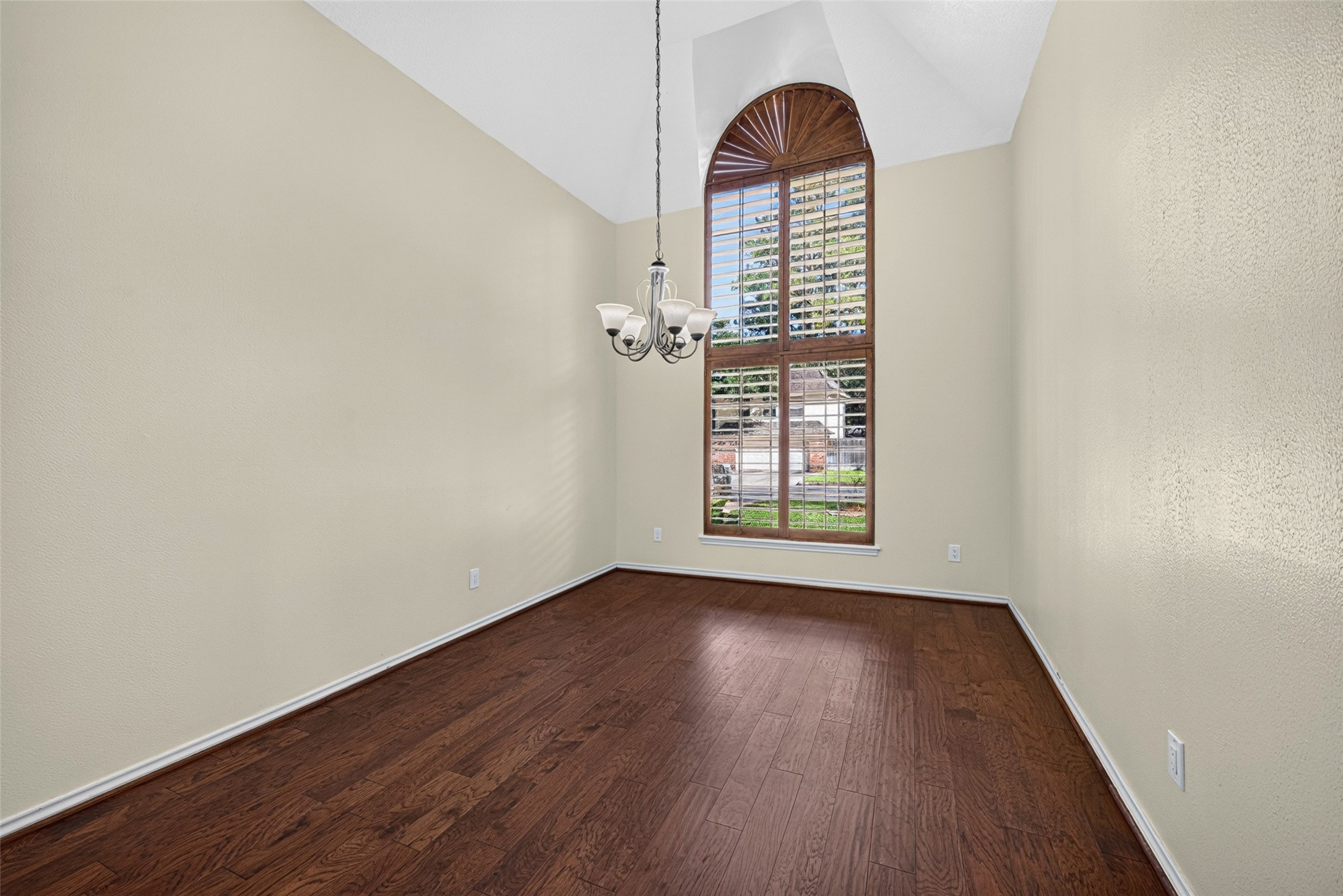 Elegant dining room featuring a vaulted ceiling.