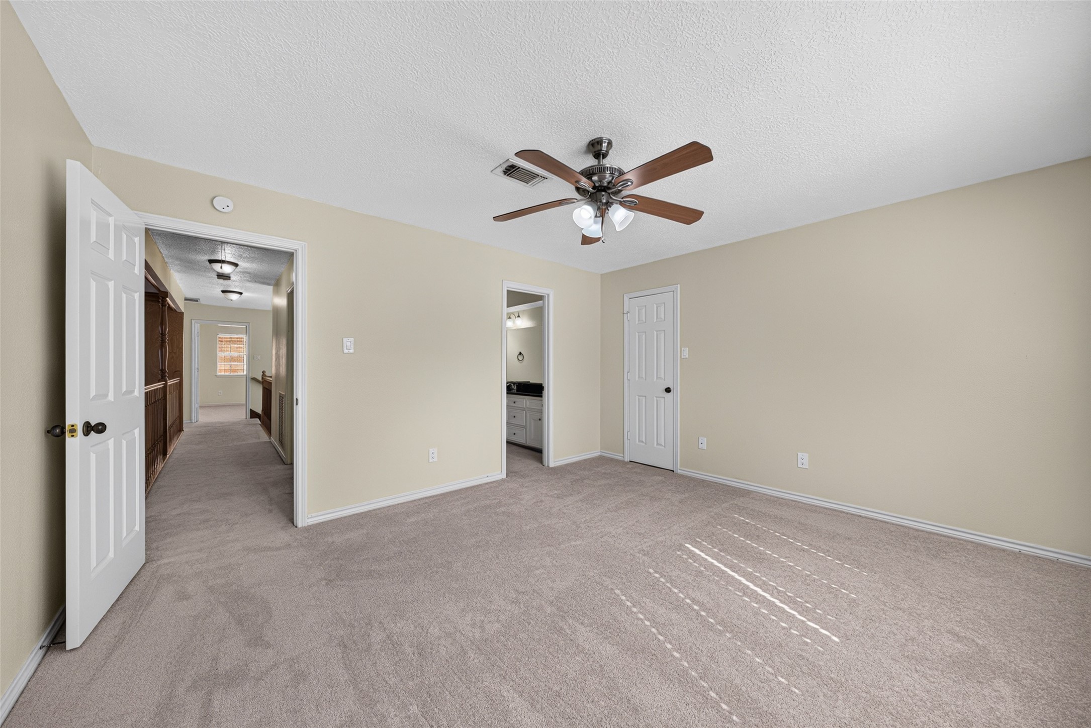 This secondary bedroom has direct access to the bathroom and a walk-in closet.