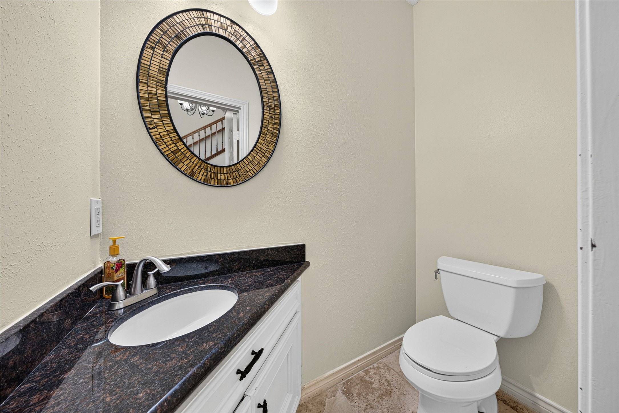 There is a half bath tucked away but centrally located to the entertaining spaces.