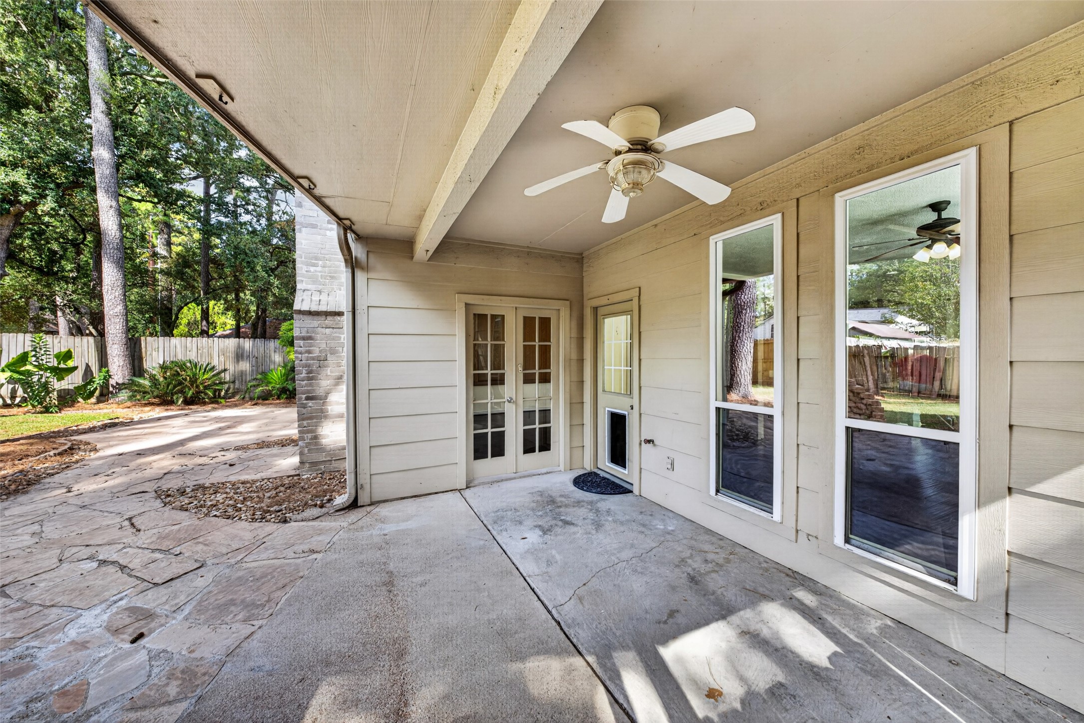 The covered patio is located off of the breakfast room and the living room, and offers a covered walk to the garage.