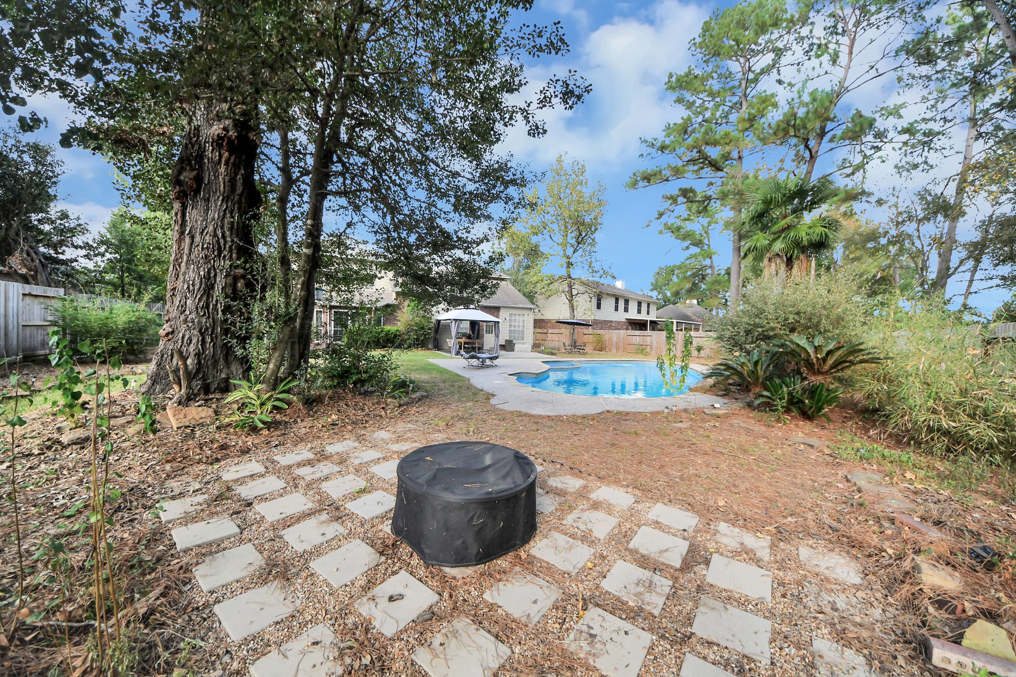 Fire Pit Sitting Area on This Oversized Backyard.