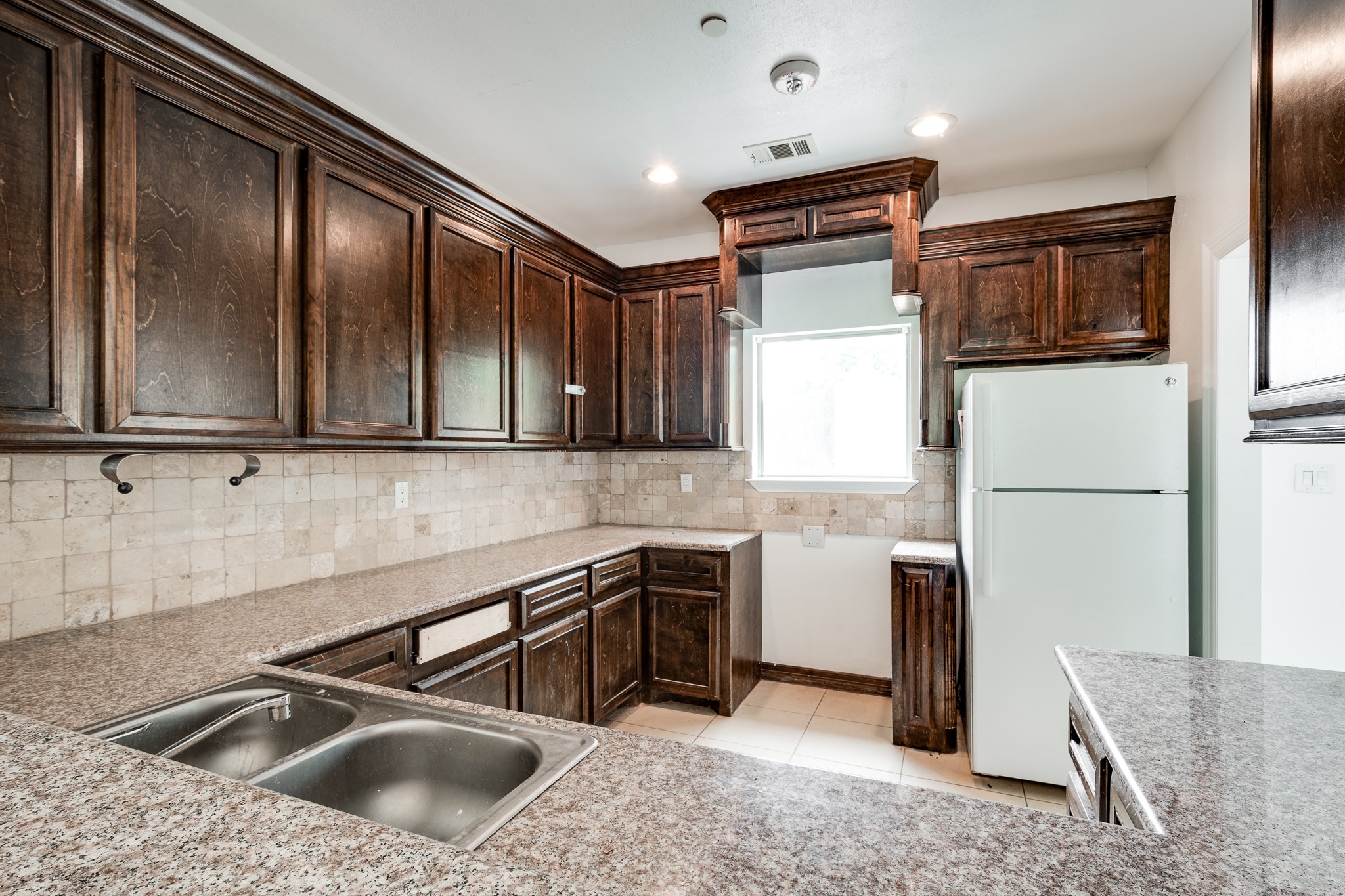 Kitchen in building #2, with solid wood cabinets and granite counter tops.