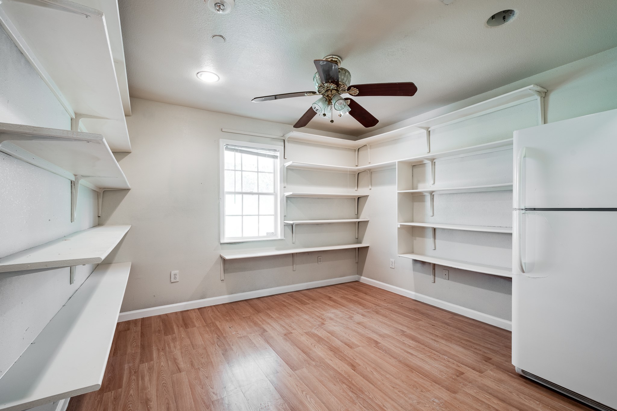 Large pantry with an additional refrigerator in building #3.