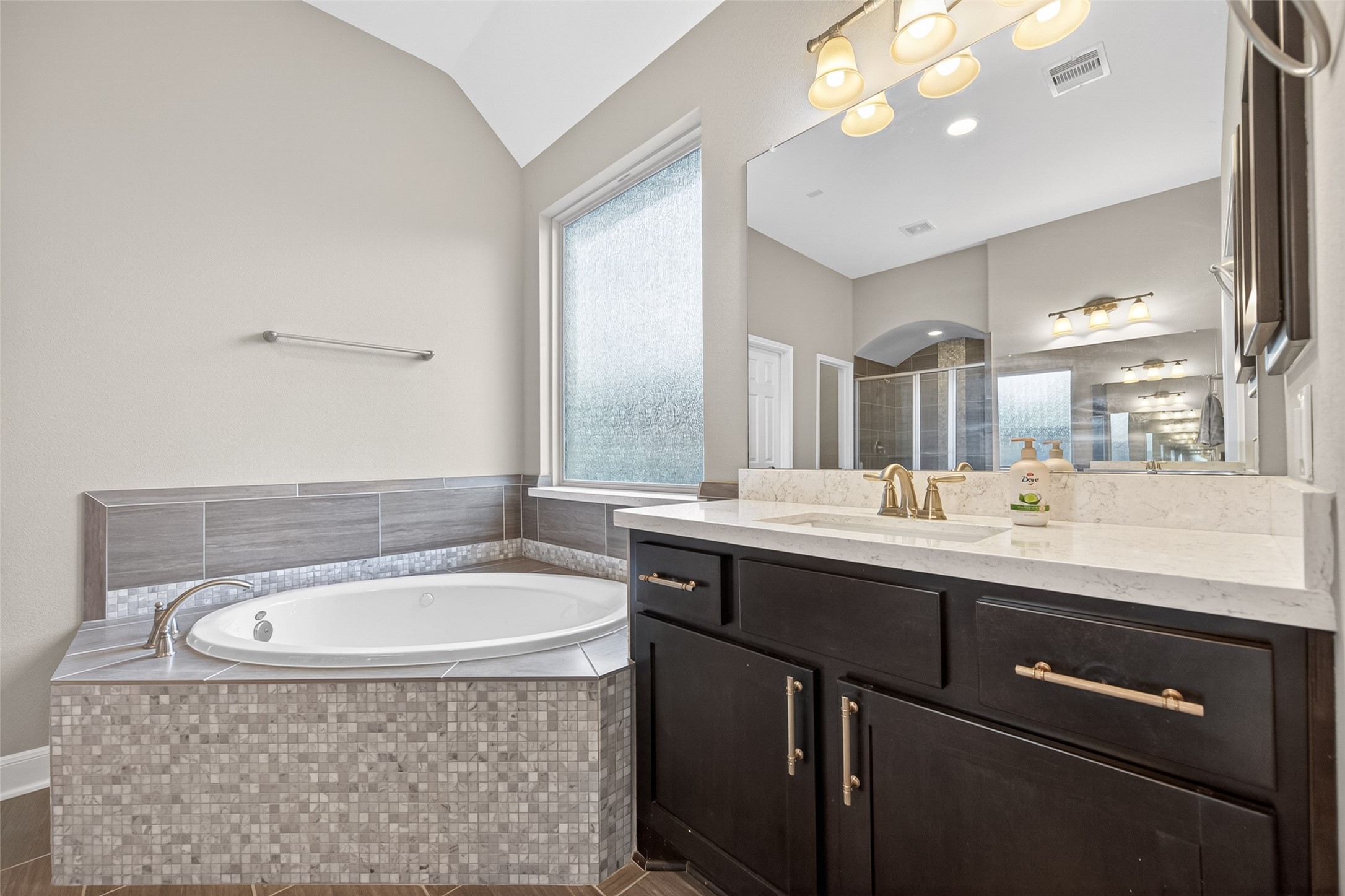 Relax in this deep soaking tub with privacy window.