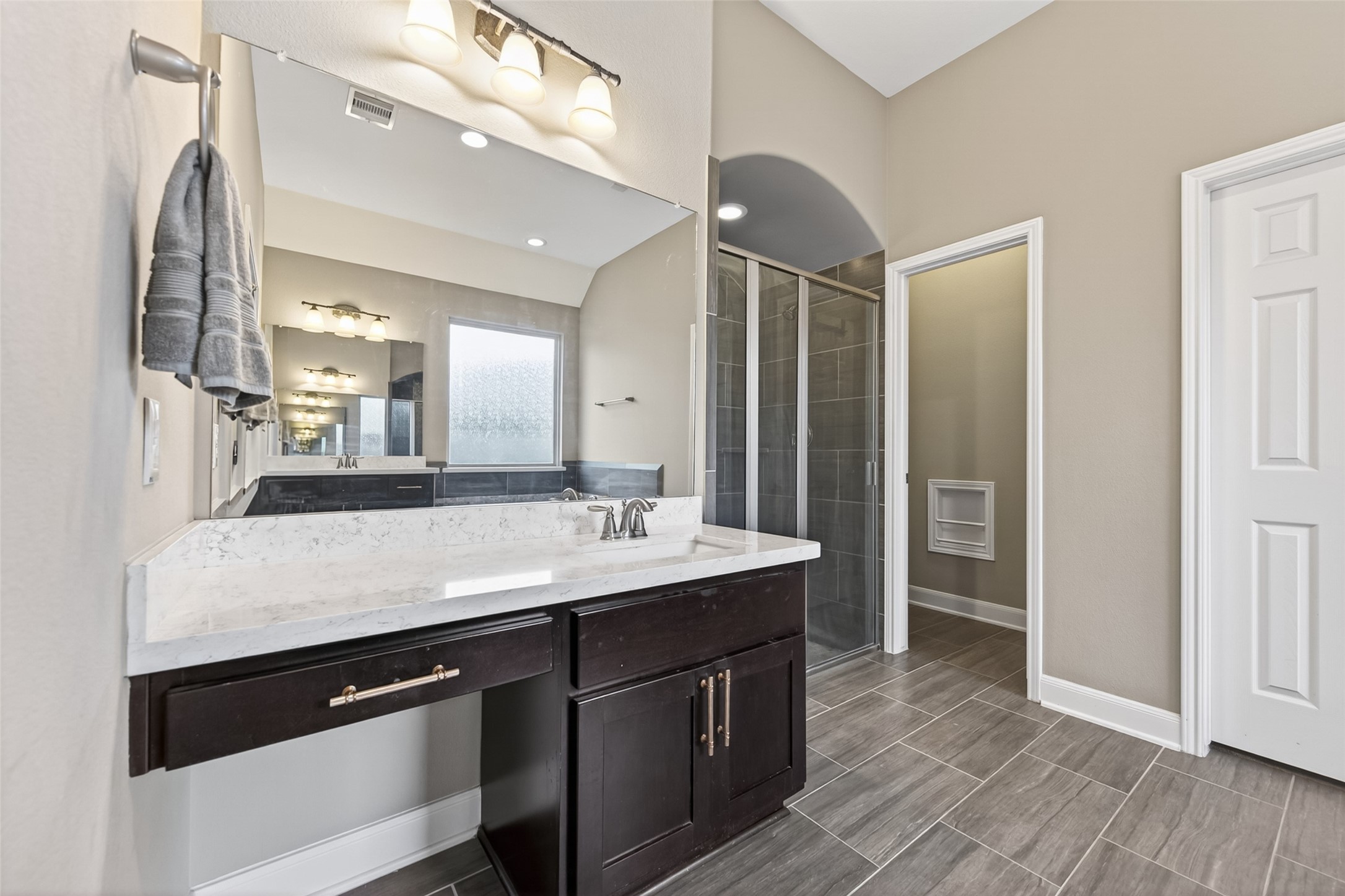 Next to the vanity space is the walk-in shower.