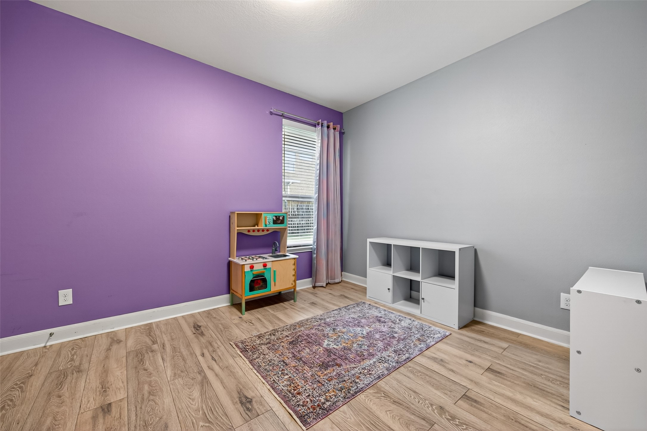 Room was recently painted to original color.  Another Secondary bedroom located adjacent to the other bedroom near the rear of the home.