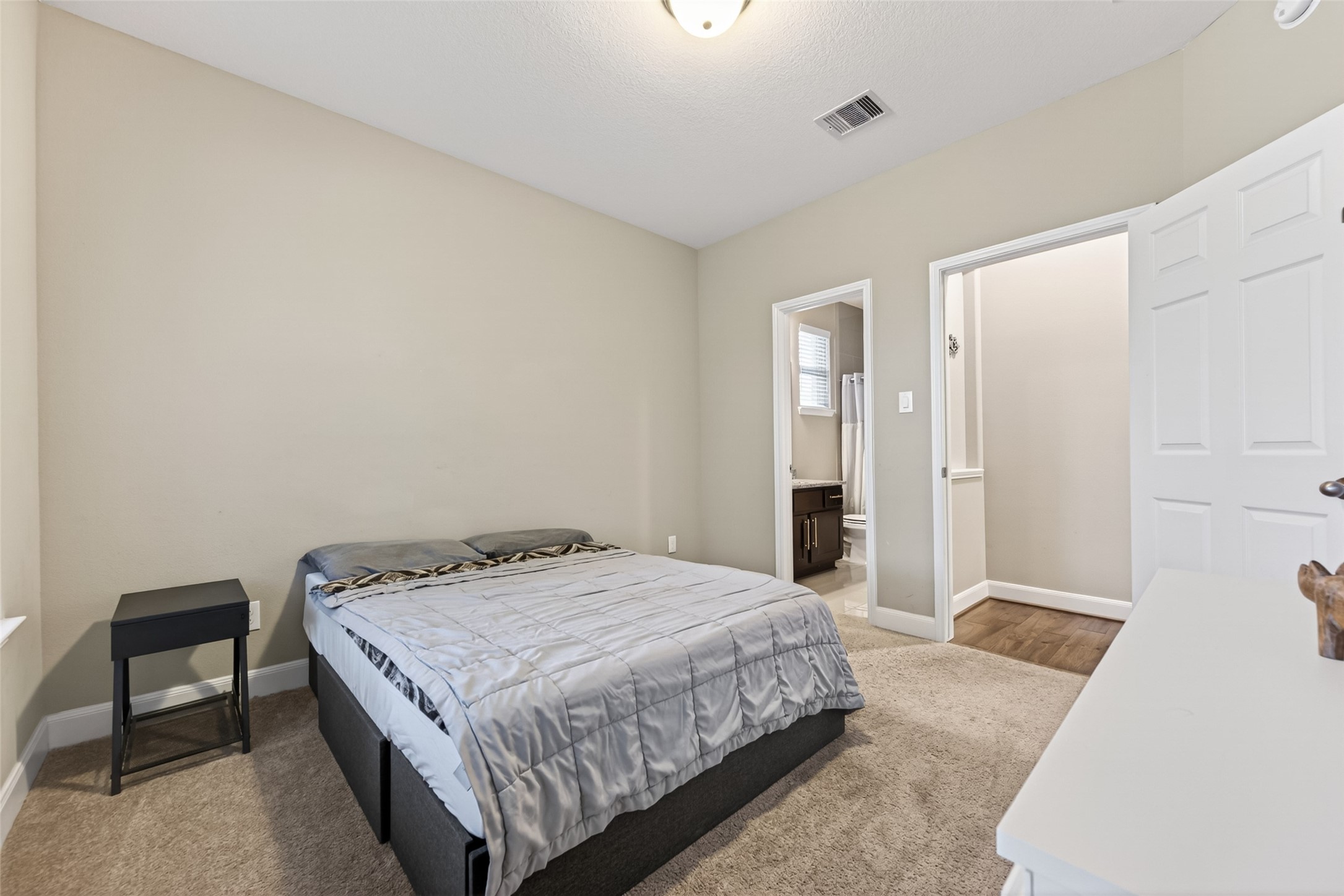 Secondary bedroom located in the front of the home with en-suite bathroom