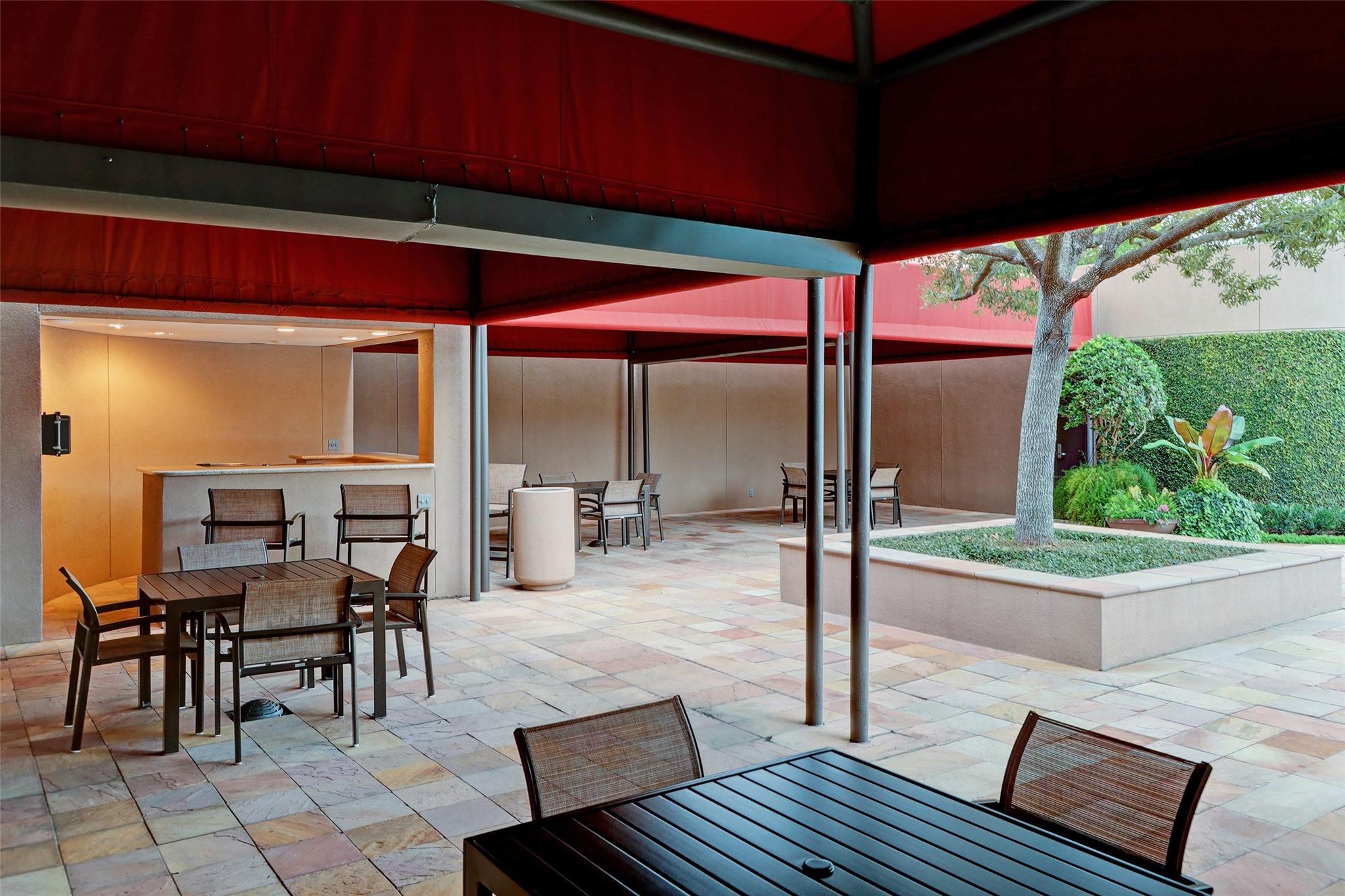 Covered dining areas at the pool area.