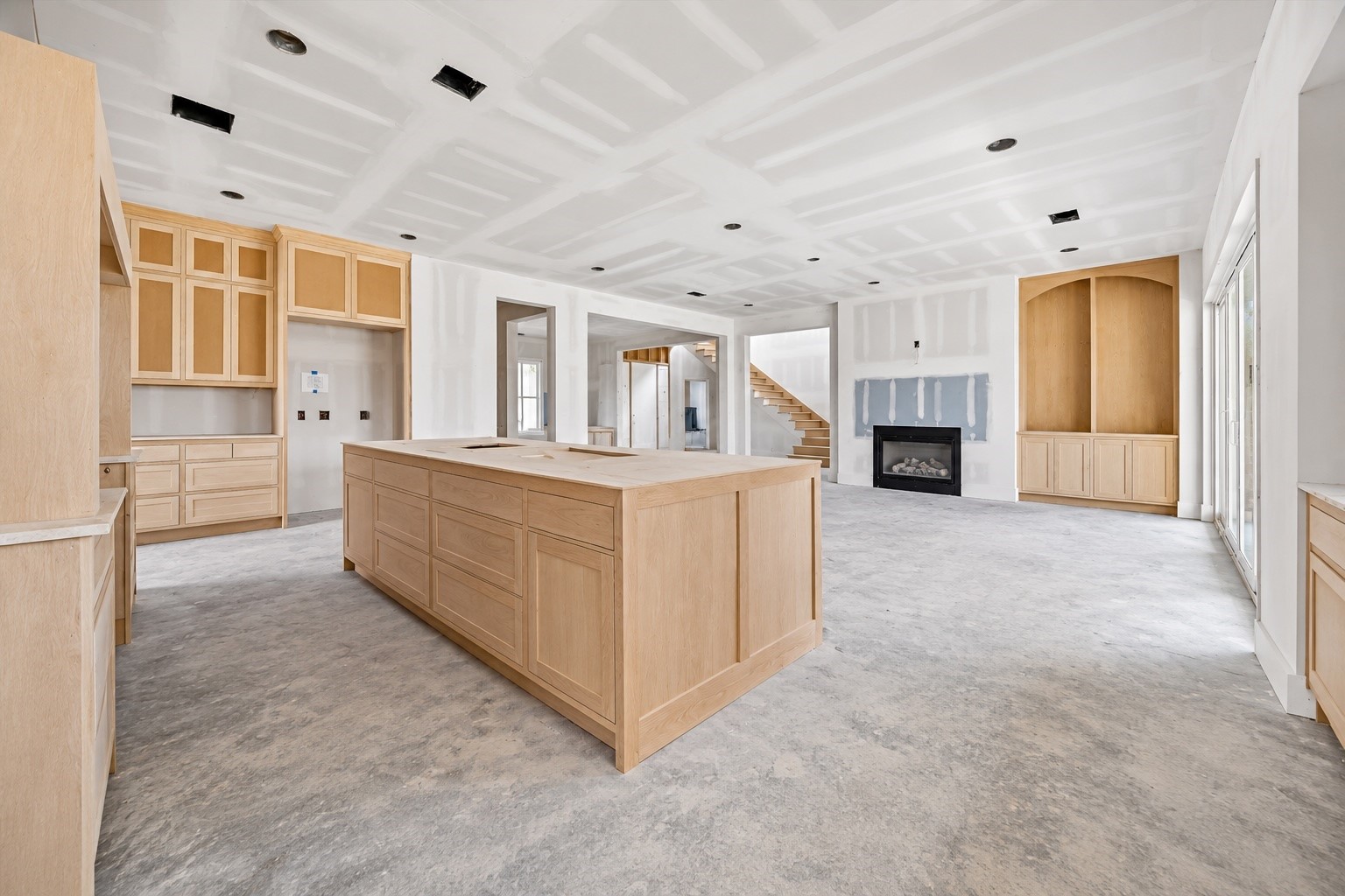 Custom cabinetry wraps the kitchen with an oversized island providing a substantial centerpiece for prep, gathering, and entertaining. **Current Construction as of 9/11/26