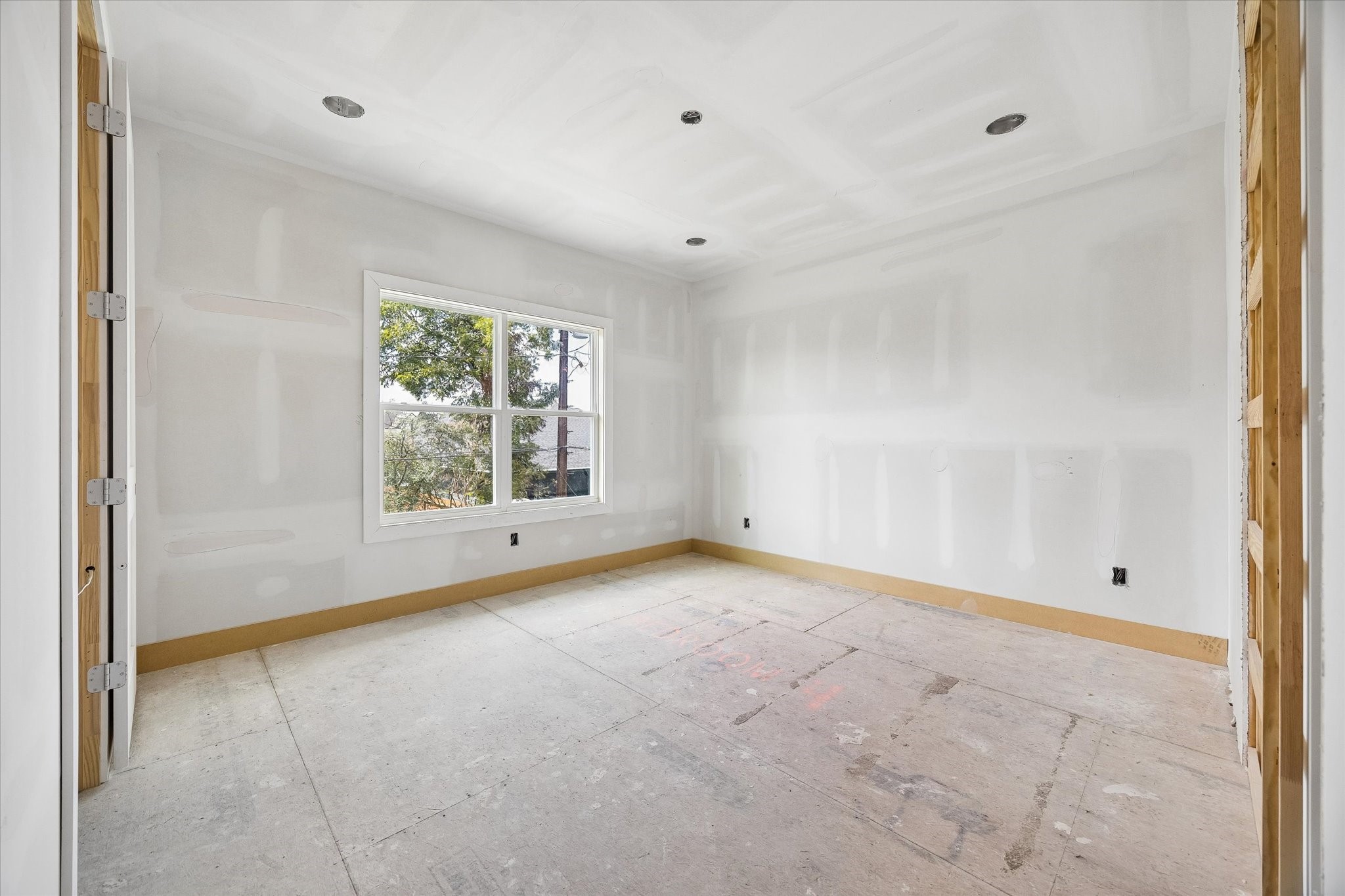 Natural light fills Bedroom 2 through a large window, while the well proportioned layout provides flexibility for a comfortable bedroom setup with room for additional storage or a study area. **Current Construction as of 9/11/26