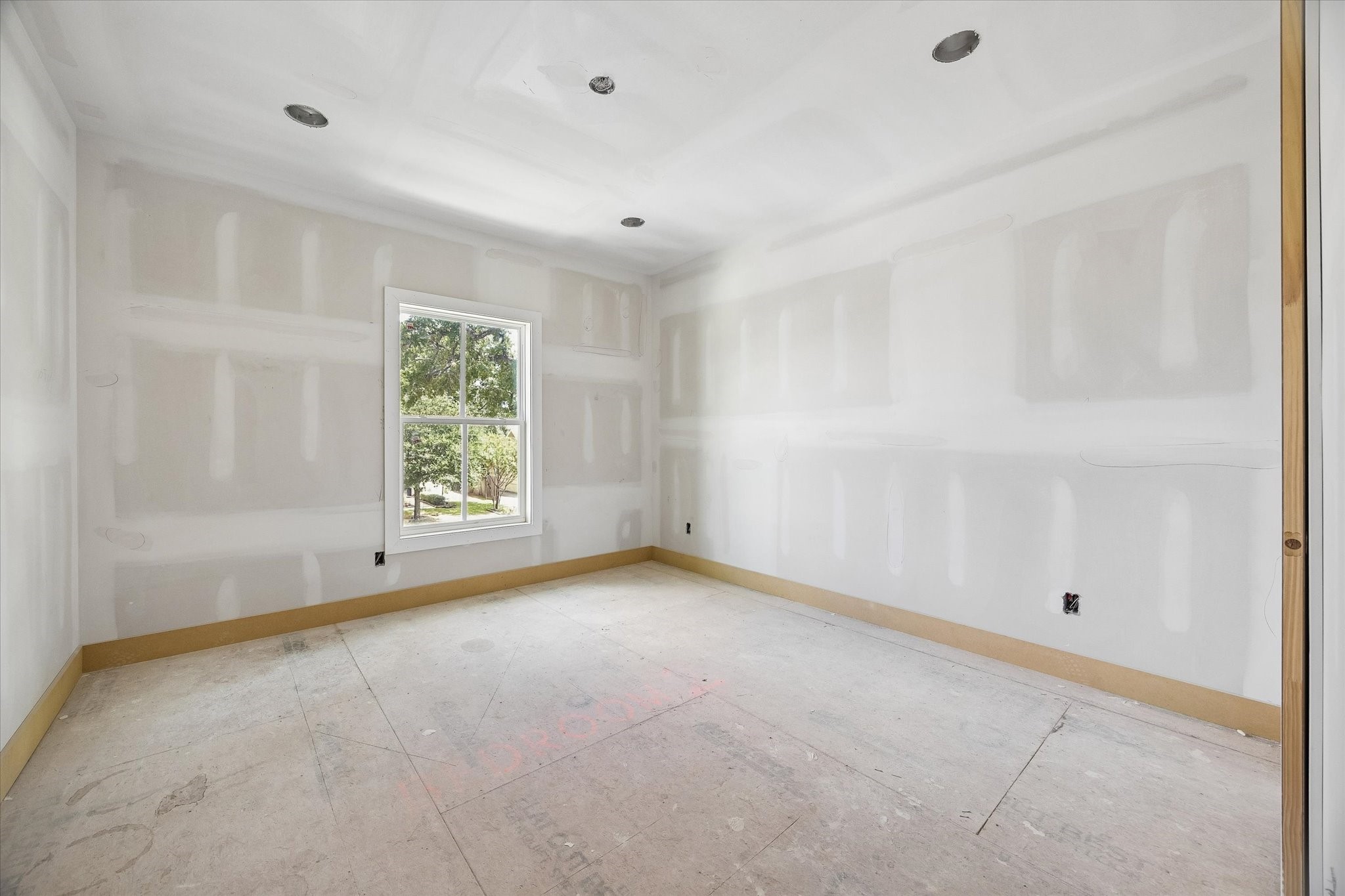 Natural light fills Bedroom 2 through a large window, while the well proportioned layout provides flexibility for a comfortable bedroom setup with room for additional storage or a study area. **Current Construction as of 9/11/26