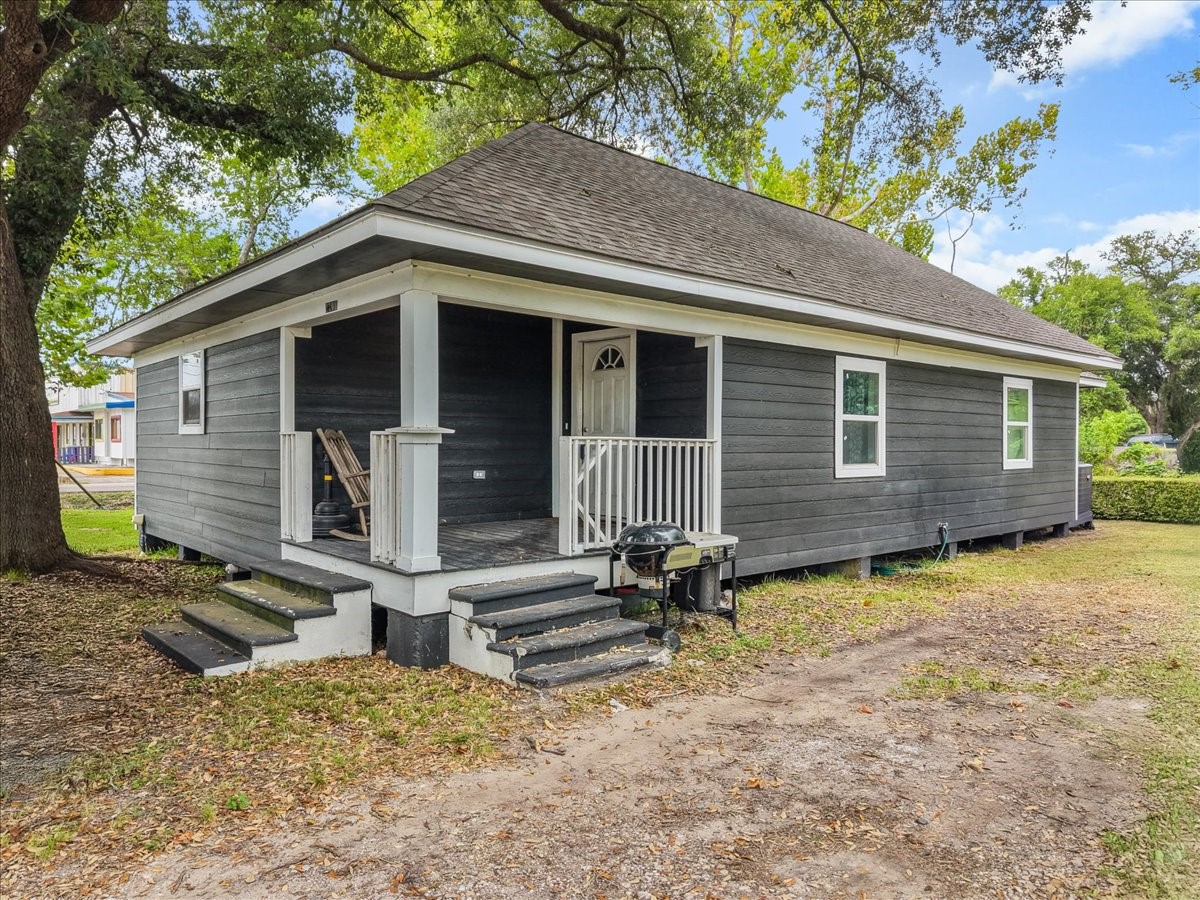 Enjoy the charm of this renovated ranch-style home, complete with two porches that offer inviting spots to relax and enjoy the outdoors. The spacious corner lot and mature trees add to the home's character and appeal.