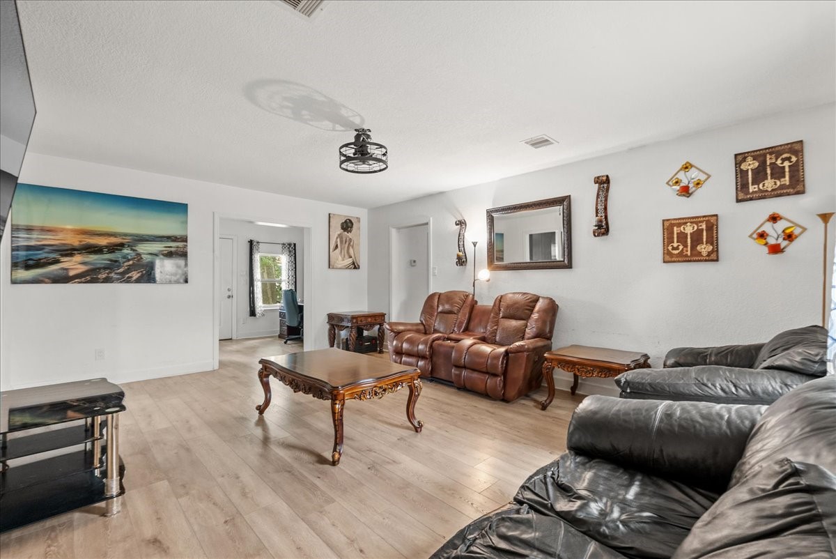 The open family room sits at the heart of the home, seamlessly connecting the kitchen, bedrooms, and flexible study or dining area for an easy, functional flow.