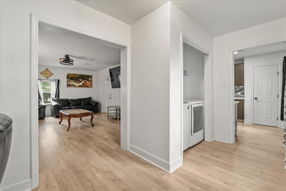 Whether you need a dedicated dining space or a spot to work from home, this open area offers flexibility while keeping the indoor laundry area conveniently out of the way.