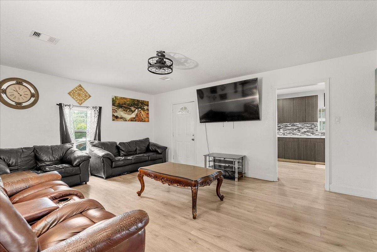 Centrally located and full of possibility, this family room keeps you connected to the kitchen, bedroom hallway, and adjoining study or dining area.