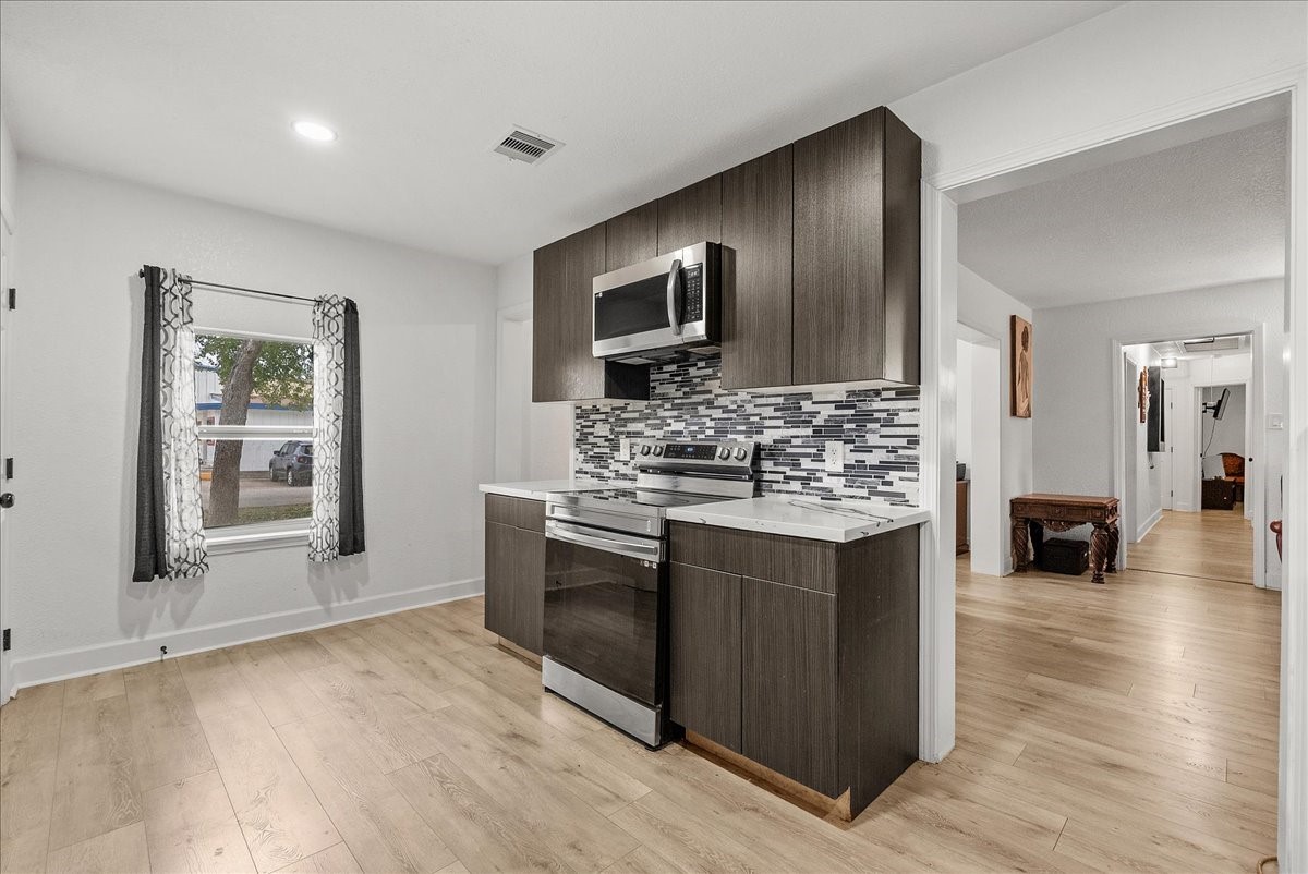 Enjoy the added charm of the kitchen windows, bringing in natural light and creating a bright, inviting atmosphere for everyday cooking and gathering.