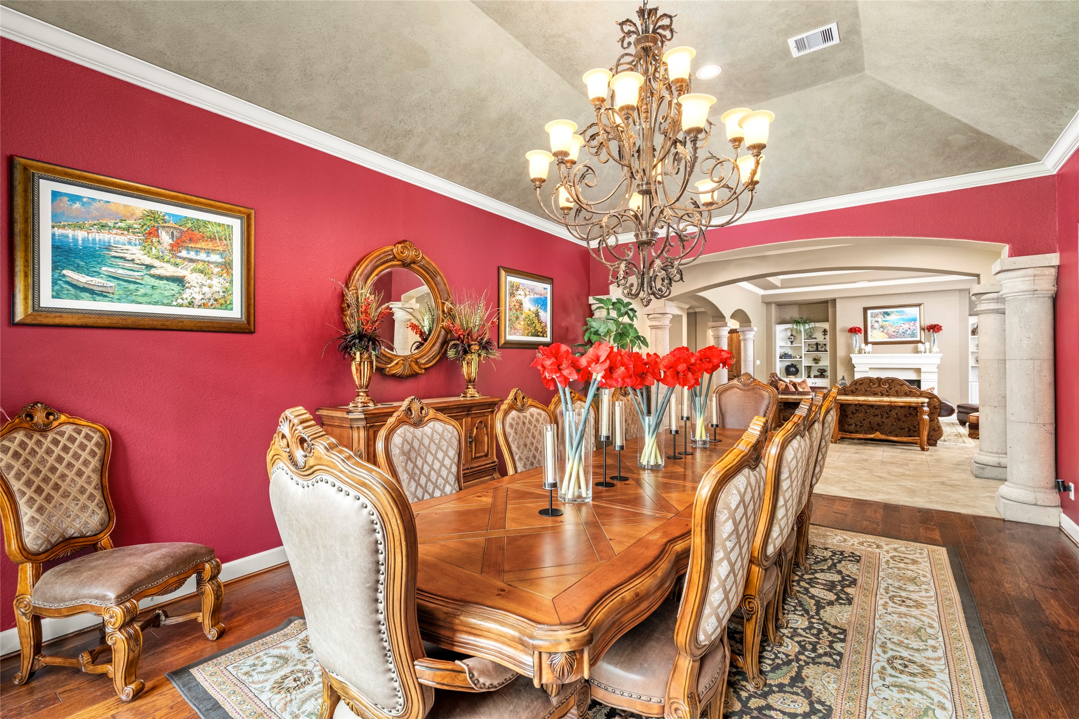 The spacious dining room features a gorgeous chandelier, creating an elegant setting for formal dinners and special occasions.