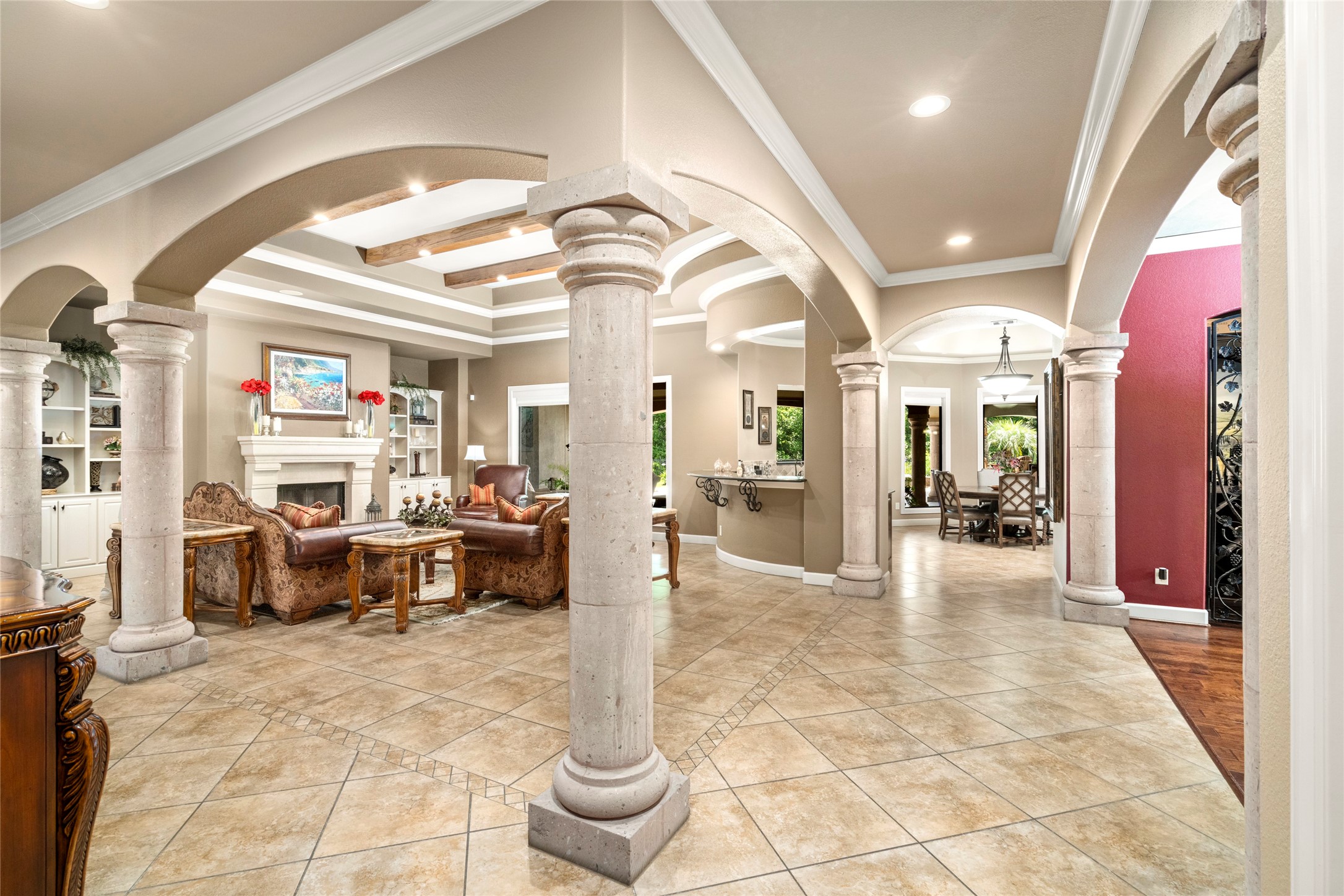 The stone columns showcase the home's architectural craftmanship, a defining element of its timeless beauty.