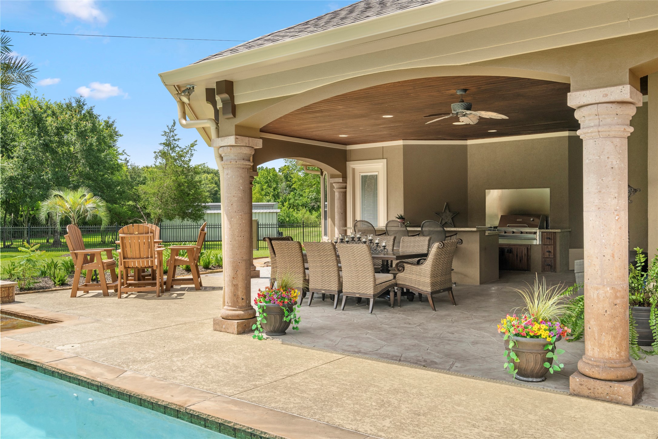 Another view of the summer kitchen area and stone columns, every detail of this home was thoughtfully executed.