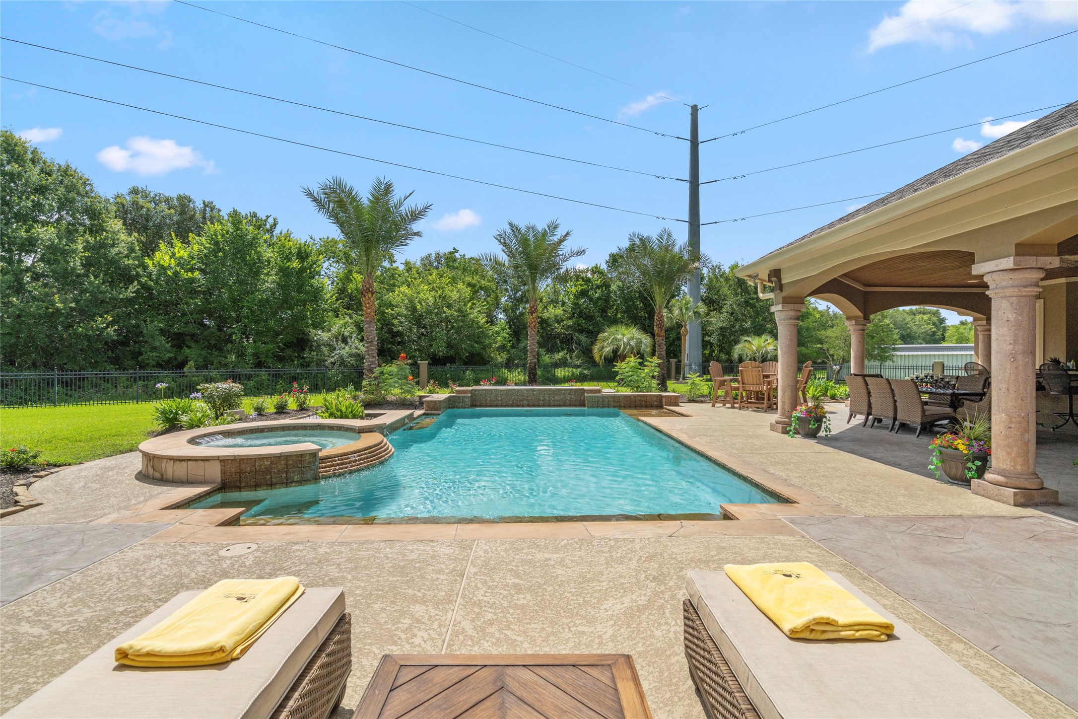 Poolside relaxation reaches new heights. The mature trees that back up to the property create a serene, secluded haven.