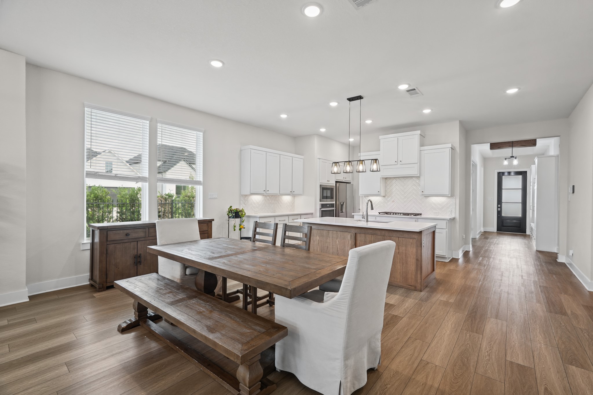 The dining area comfortably seats a crowd and opens right to the kitchen, making holiday dinners and ordinary weeknight meals equally easy in this well-connected floor plan.