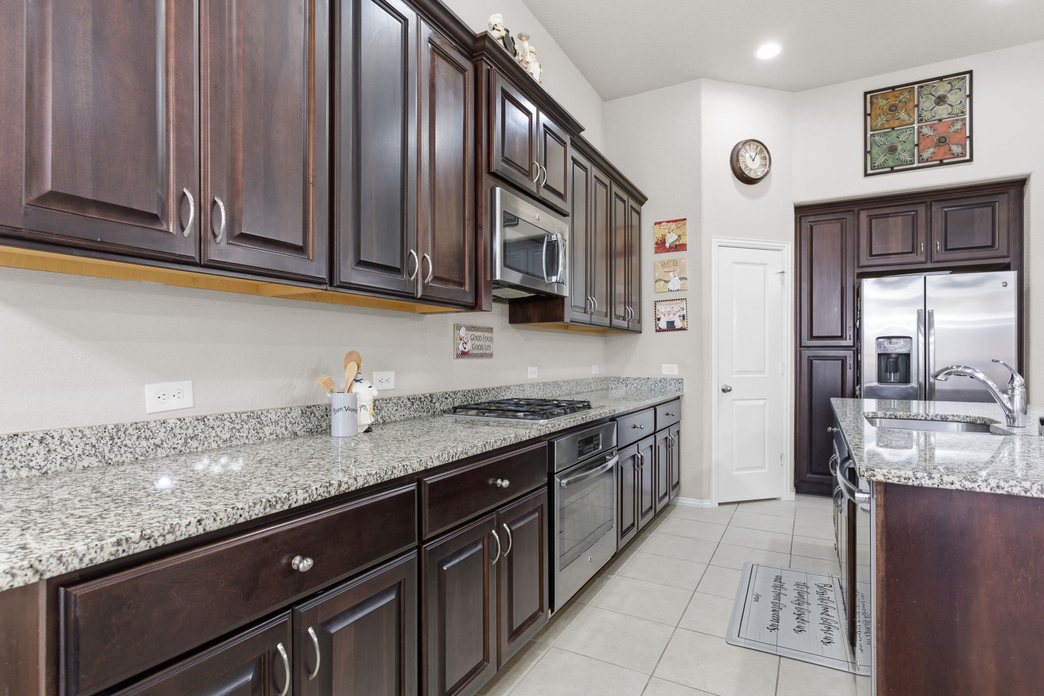 Beautiful kitchen features granite counter tops and massive kitchen island perfect for family gatherings!