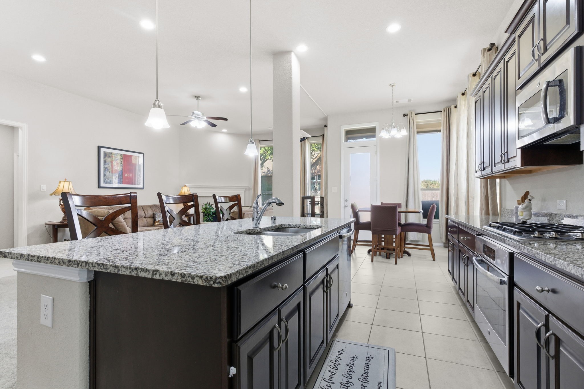 View from large pantry showcases open concept with tons of ambient lighting!