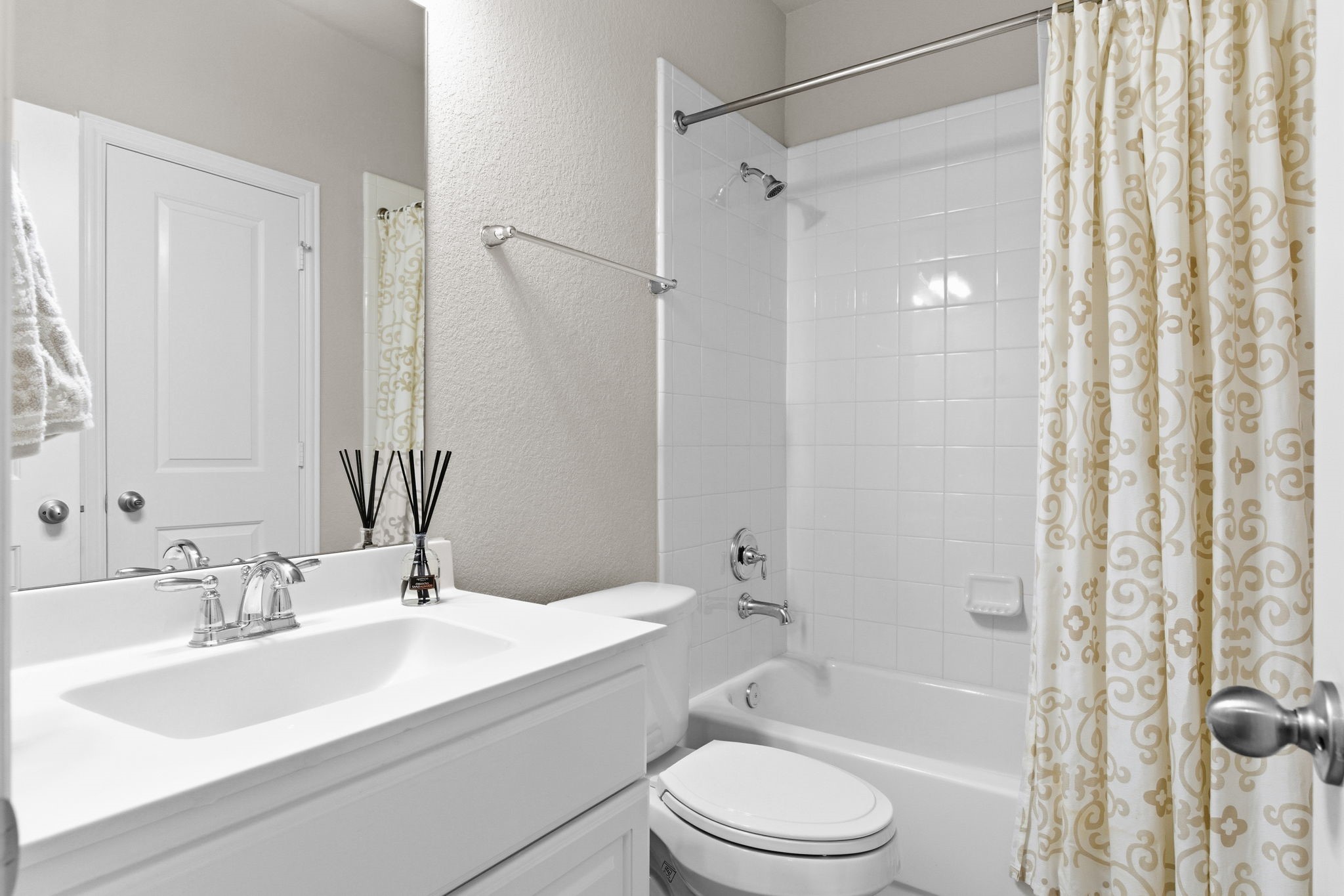 Full bath with private vanity for secondary bedroom.