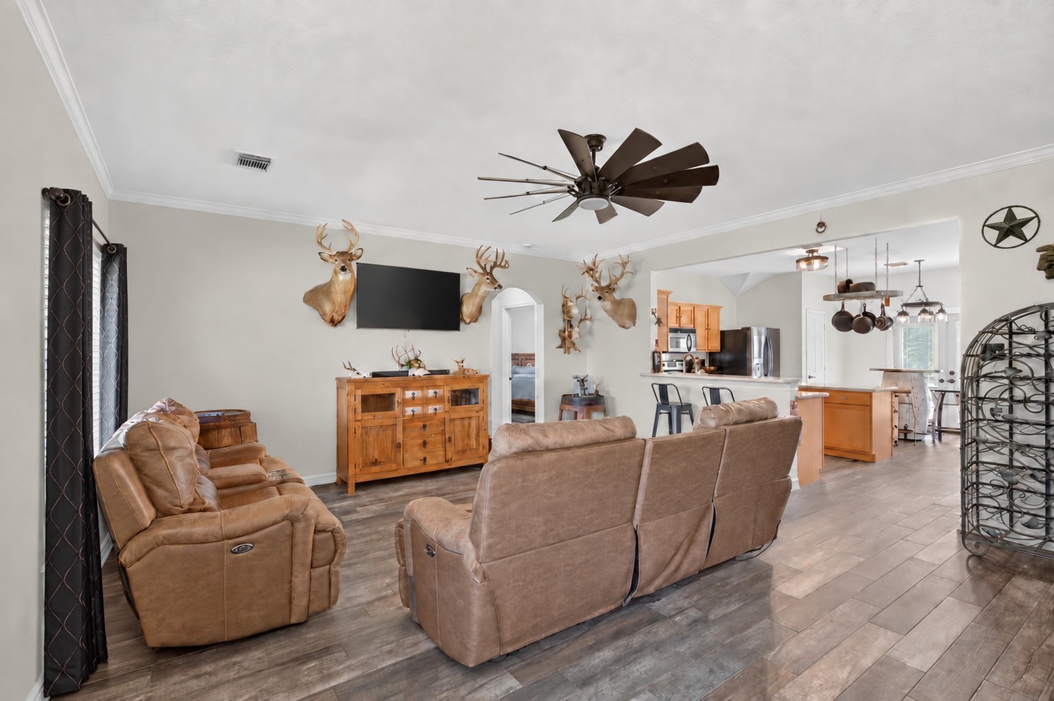 Spacious living room with an open layout and tile flooring extending throughout the main areas of the home. Spacious living room with an open layout and tile flooring extending throughout the main areas of the home.