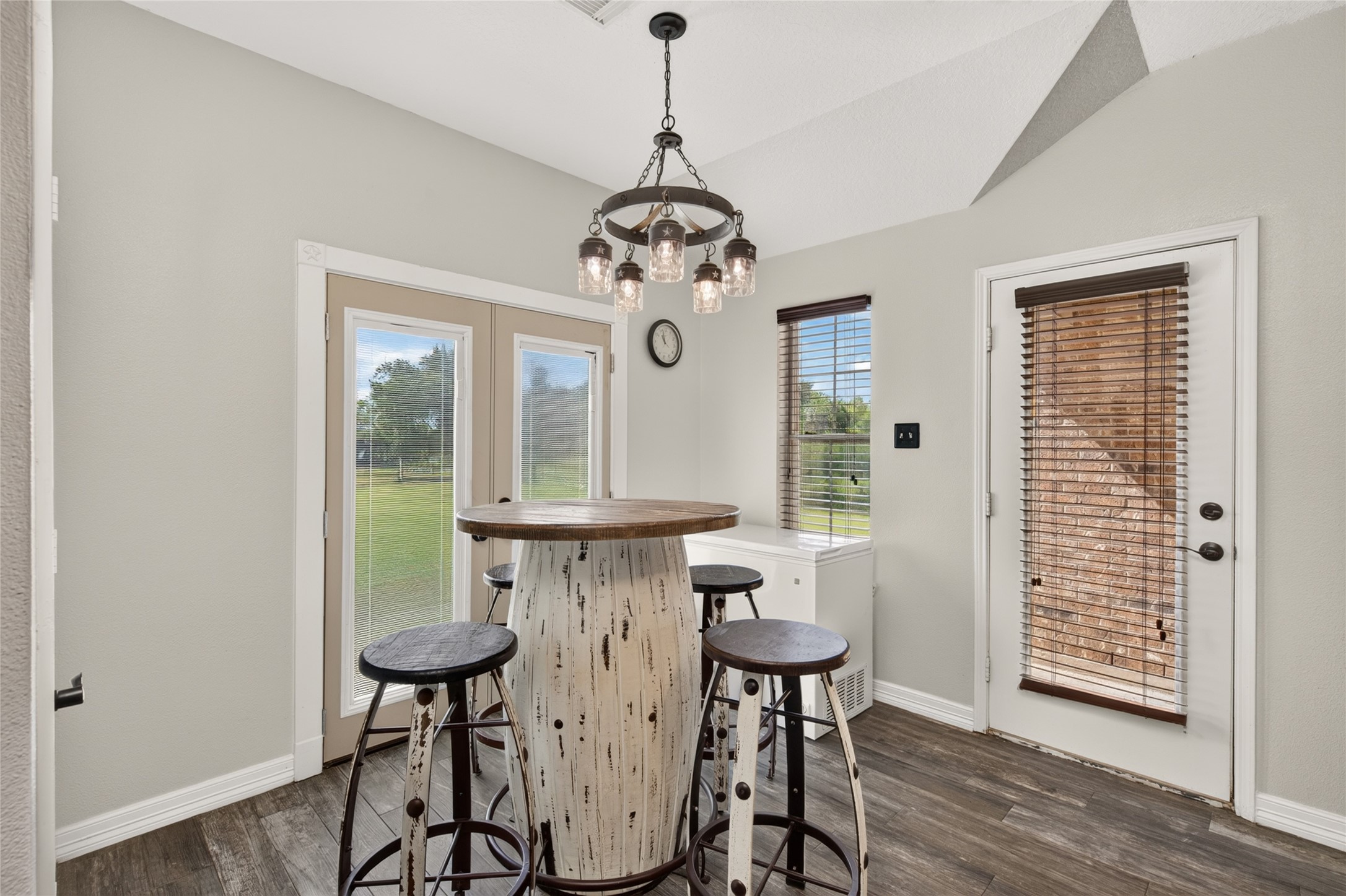 Charming breakfast area with French doors to the backyard views and a second door leading to a patio. Charming breakfast area with French doors to the backyard views and a second door leading to a patio.