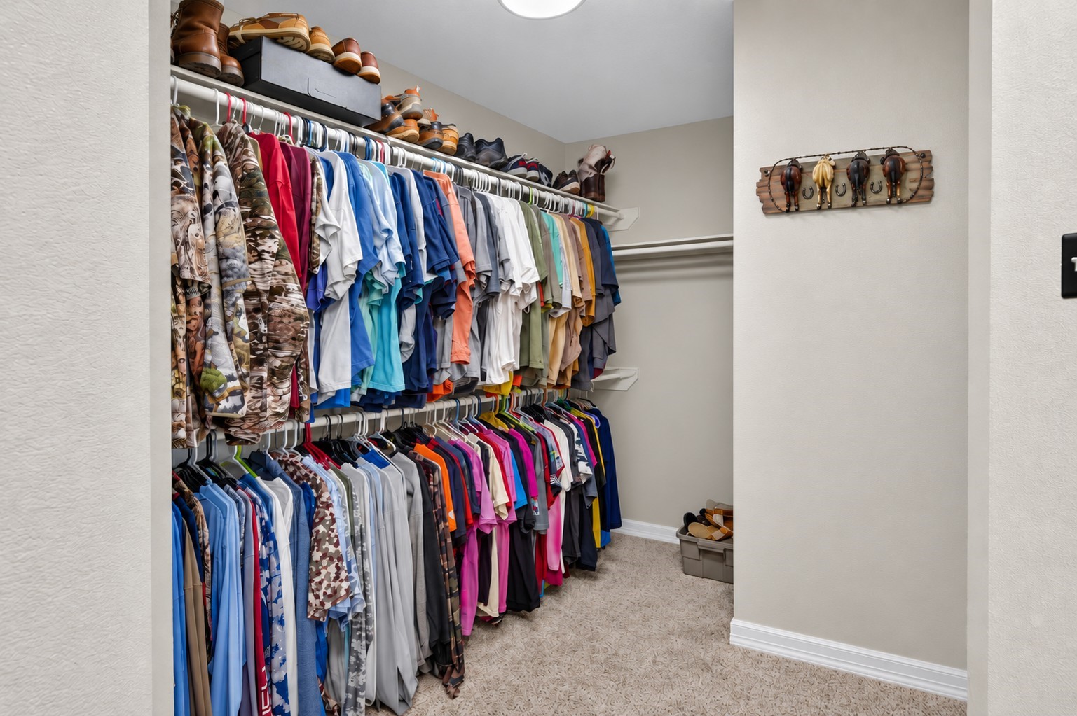 Oversized walk-in closet in the primary suite offers an abundance of storage and hanging space.