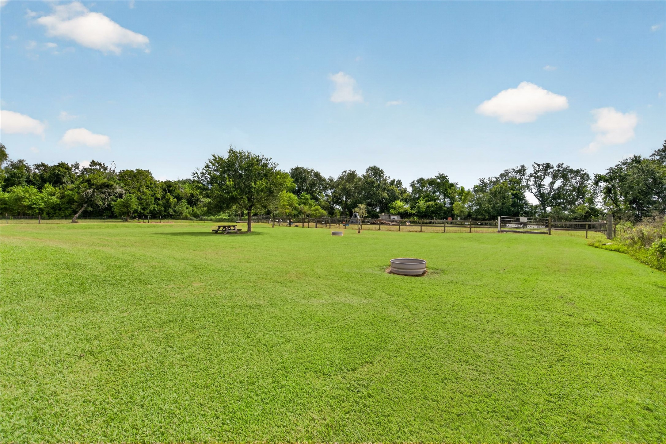Expansive backyard offers plenty of room for a future in-ground pool, additional shop, or other outdoor improvements.