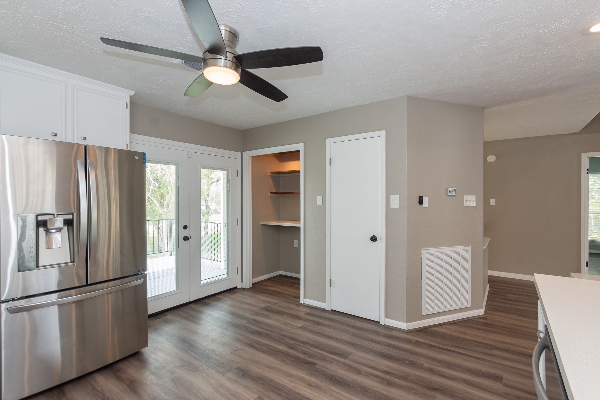 A lighted built-in shelving nook makes the perfect coffee station or dry bar, adding both charm and functionality. Next to it, youll find a full pantry closet for extra storage.