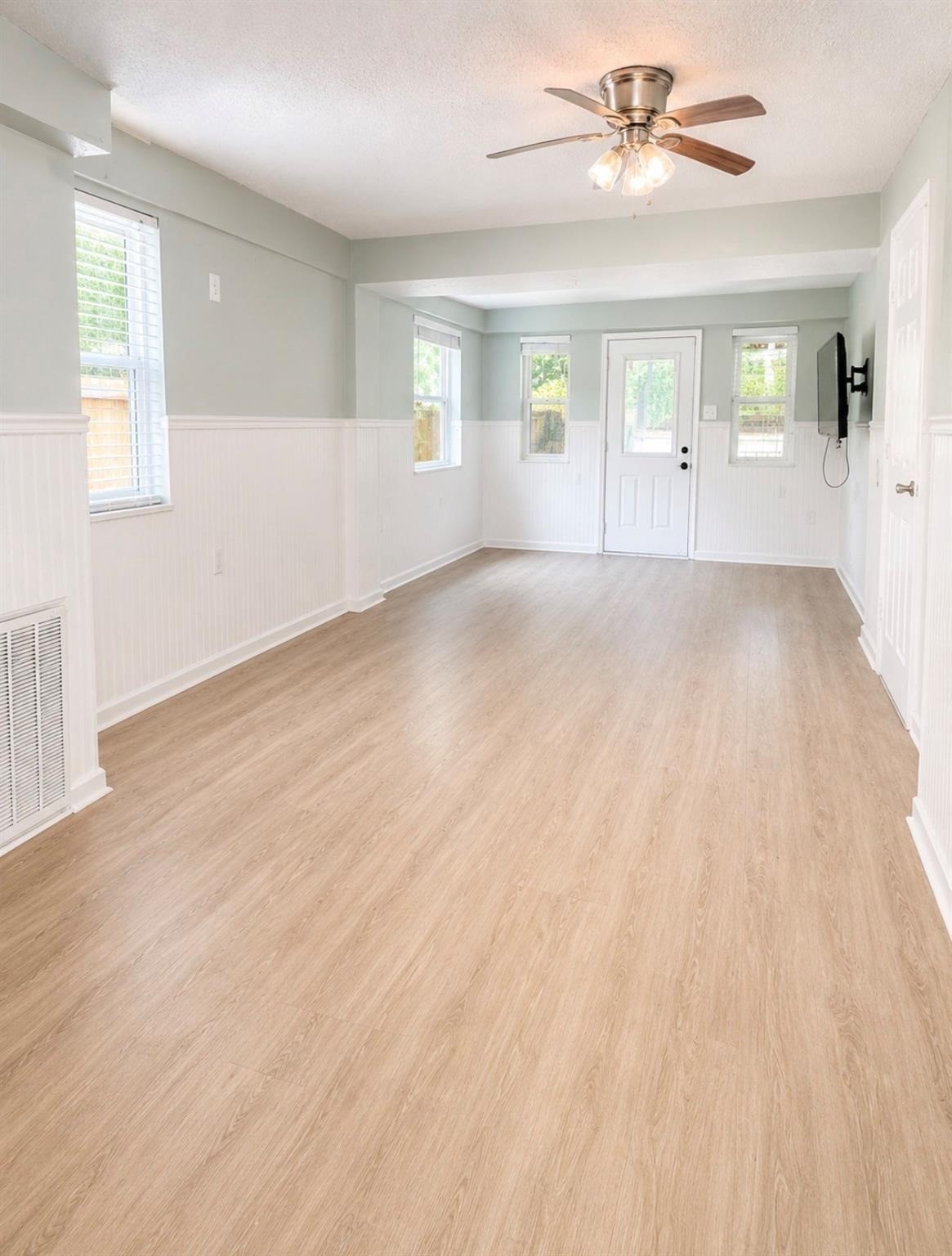 3rd bedroom downstairs with door that leads to back deck. This room has a full bathroom.