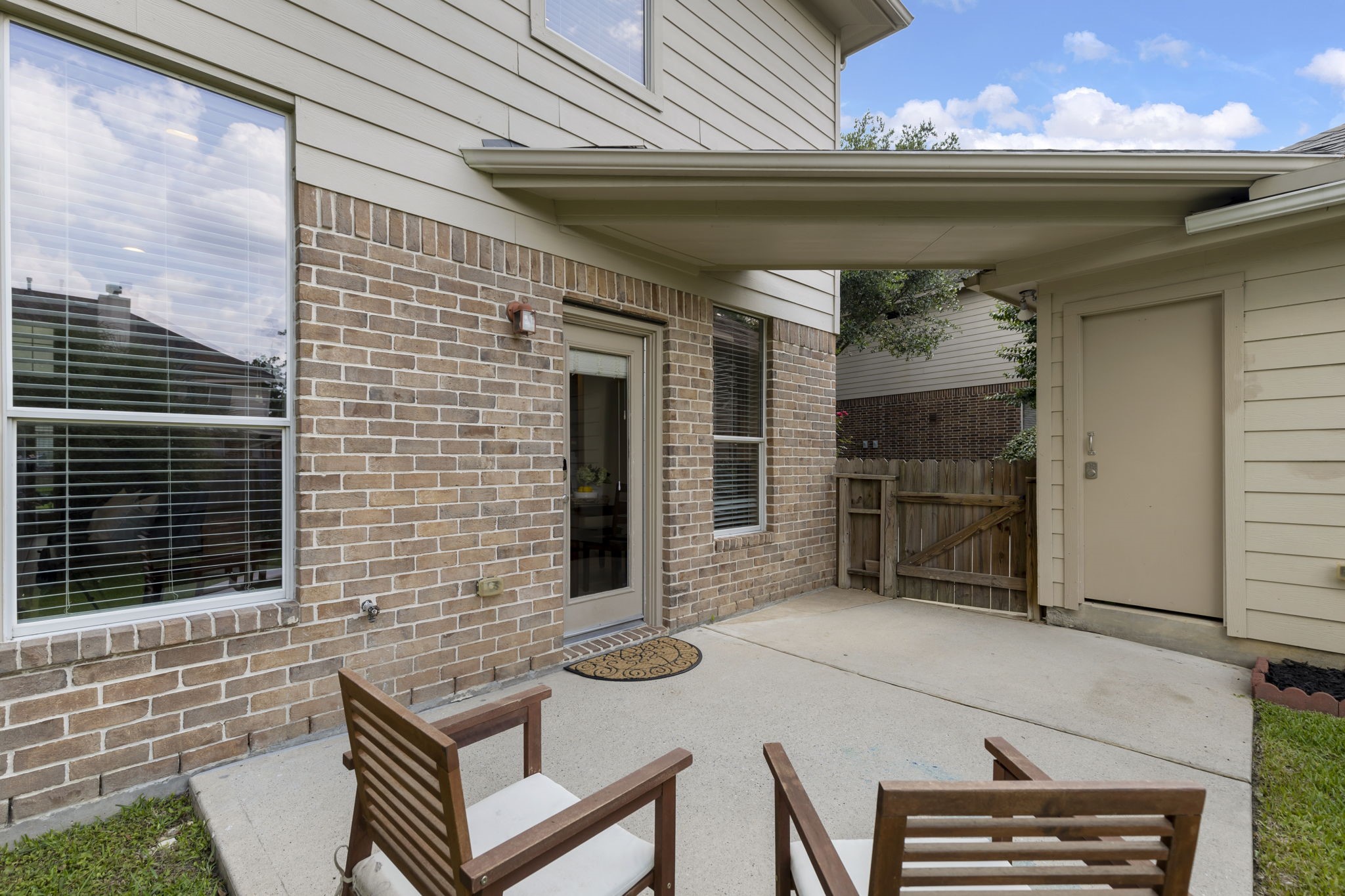 The patio offers the perfect space to enjoy your morning coffee, unwind in the evenings, or gather with friends while overlooking the backyard.