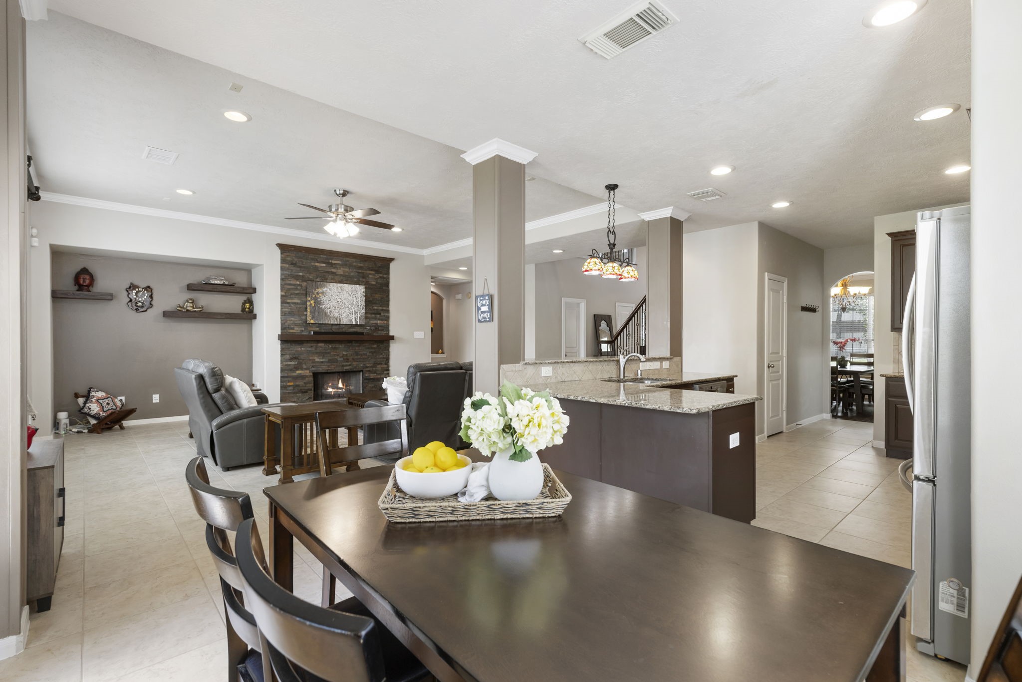 The open-concept design connects the kitchen, breakfast area, and living room, creating the perfect layout for gathering and entertaining.