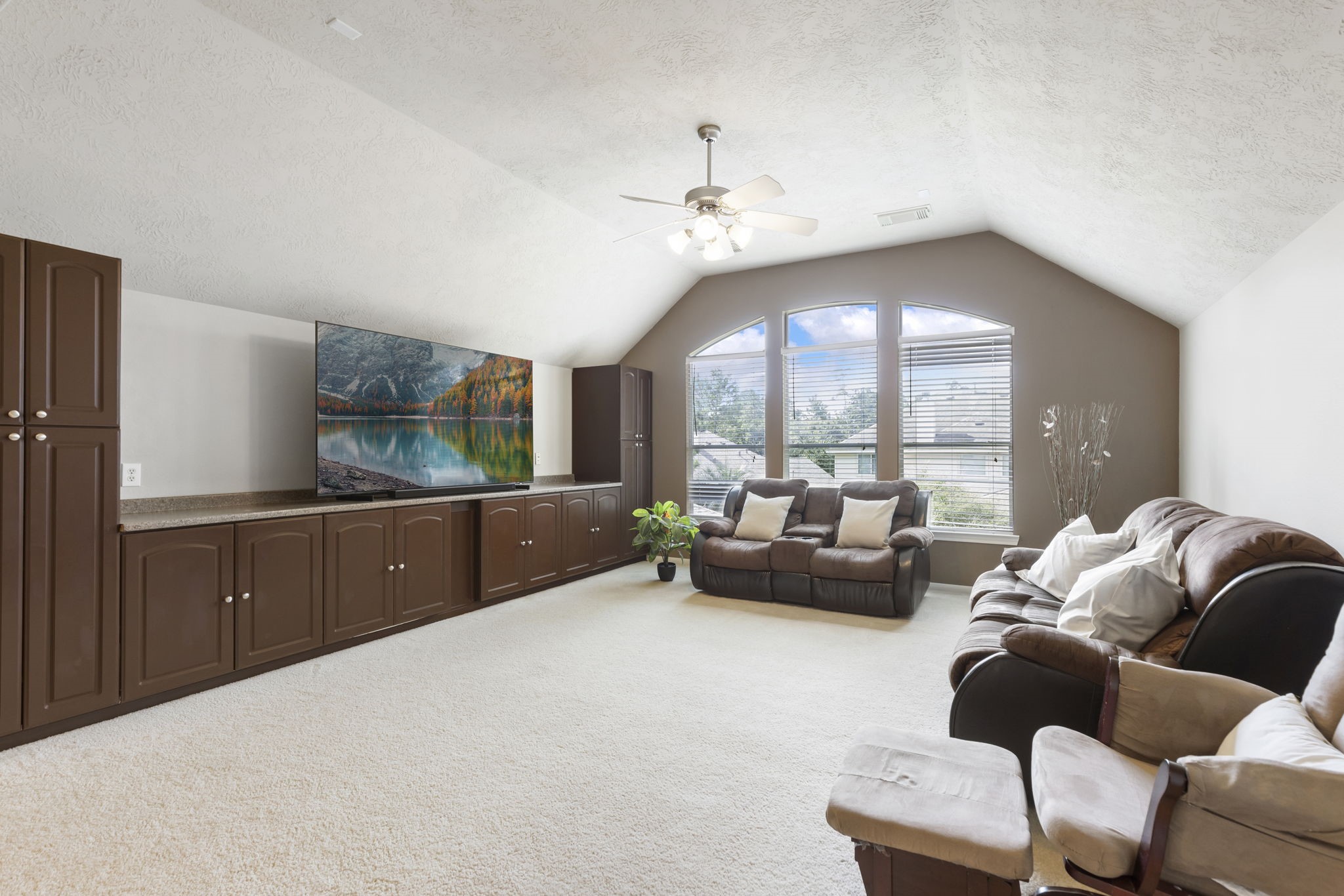 The spacious upstairs game room provides endless possibilities  from movie nights and play space to a relaxing second living area.