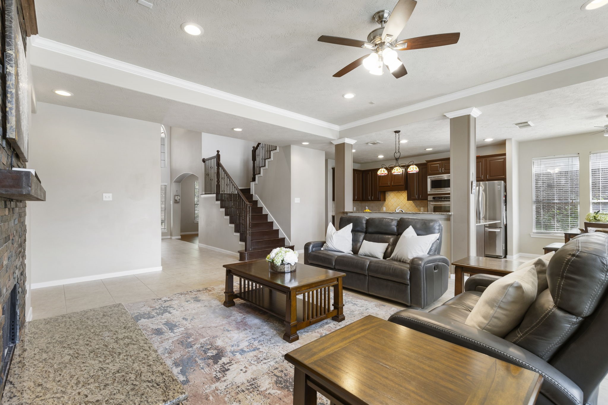 The open-concept layout creates a seamless connection between the living room and kitchen, making everyday living and entertaining effortless.