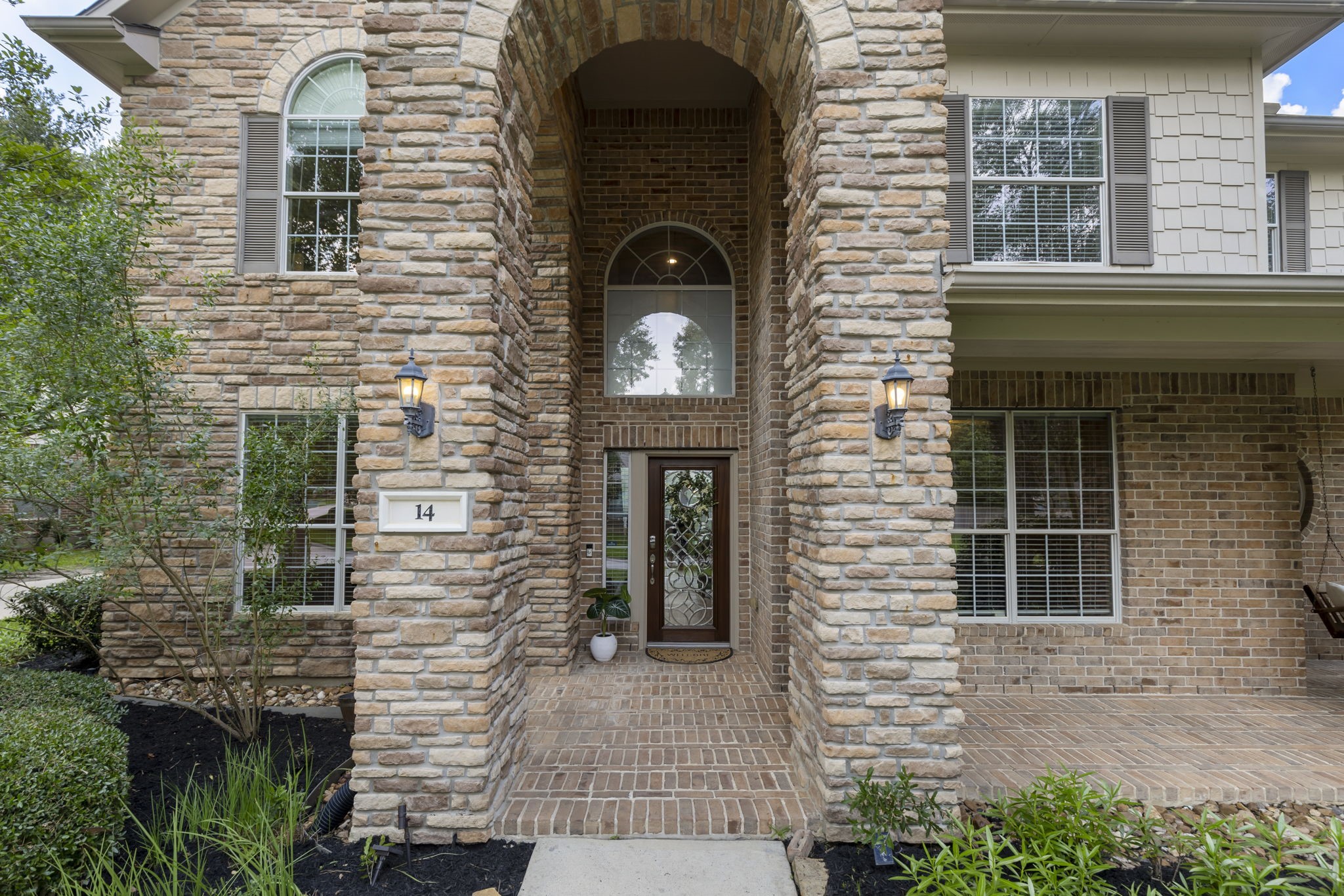 A charming covered front porch and impressive entry create the perfect blend of elegance and warmth before you even step inside.