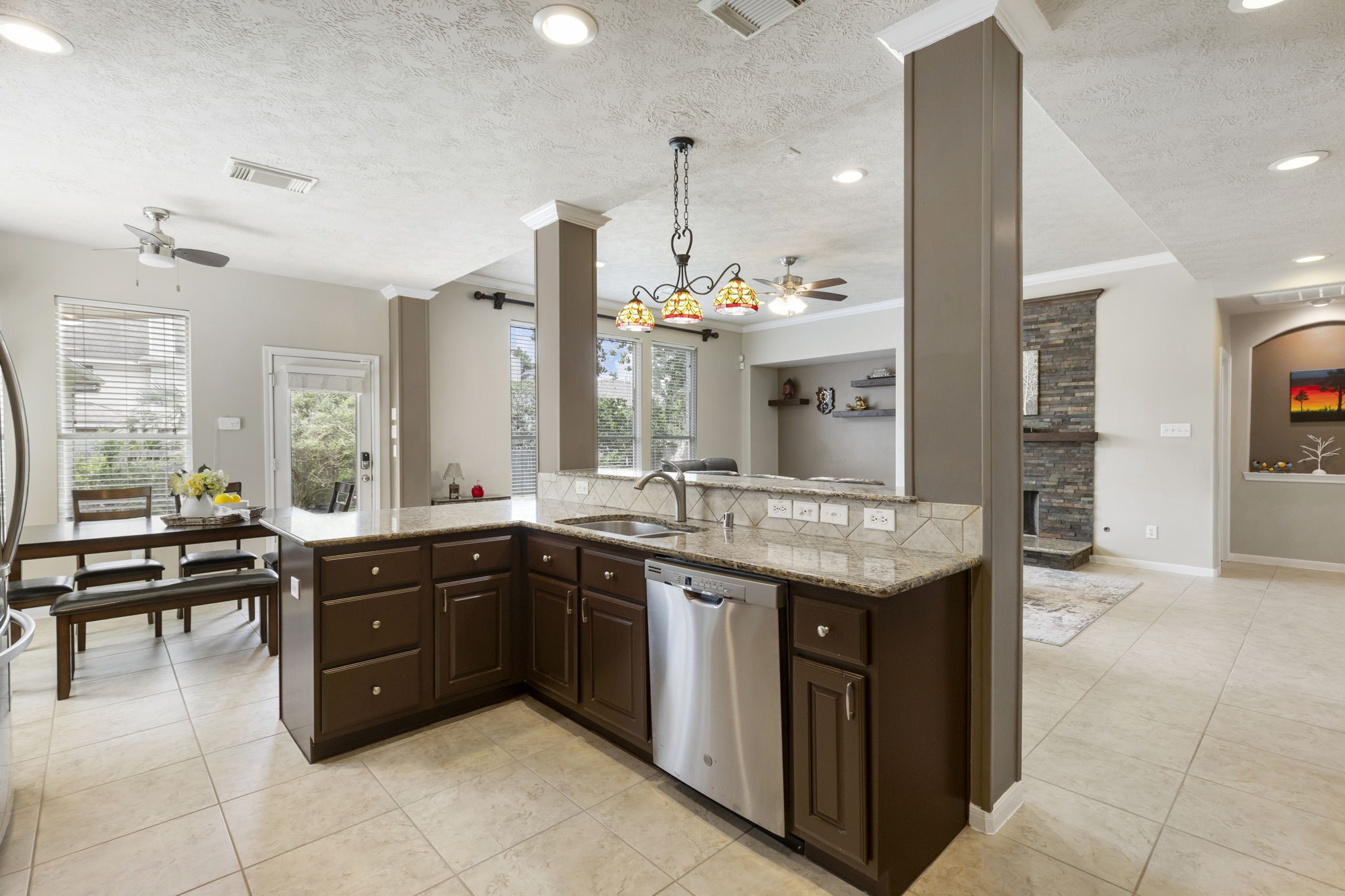 The open kitchen overlooks the living and breakfast areas, allowing you to easily entertain guests while staying connected to the heart of the home.