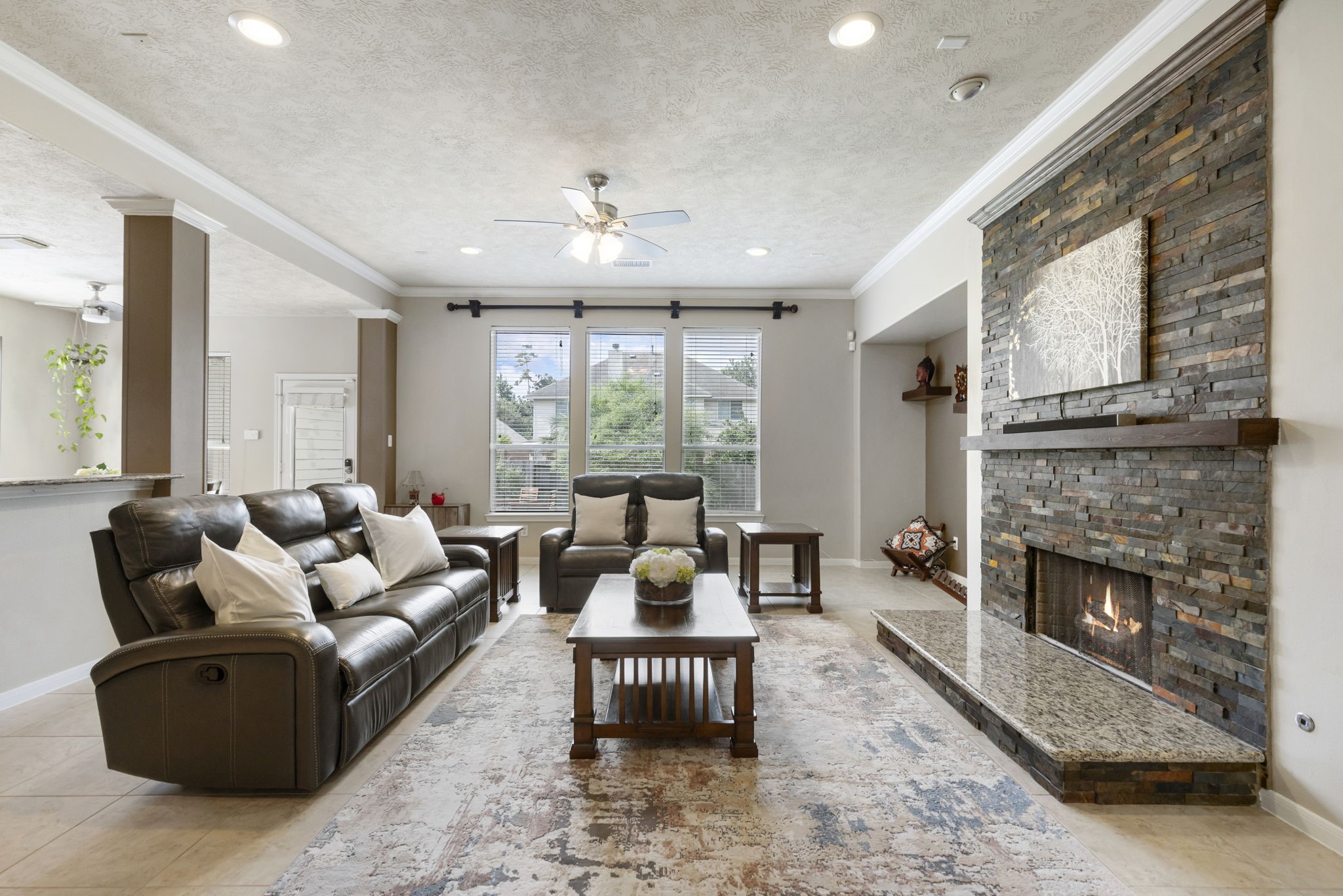 Designed with comfort in mind, the spacious family room offers a warm atmosphere with a stunning fireplace as the centerpiece.