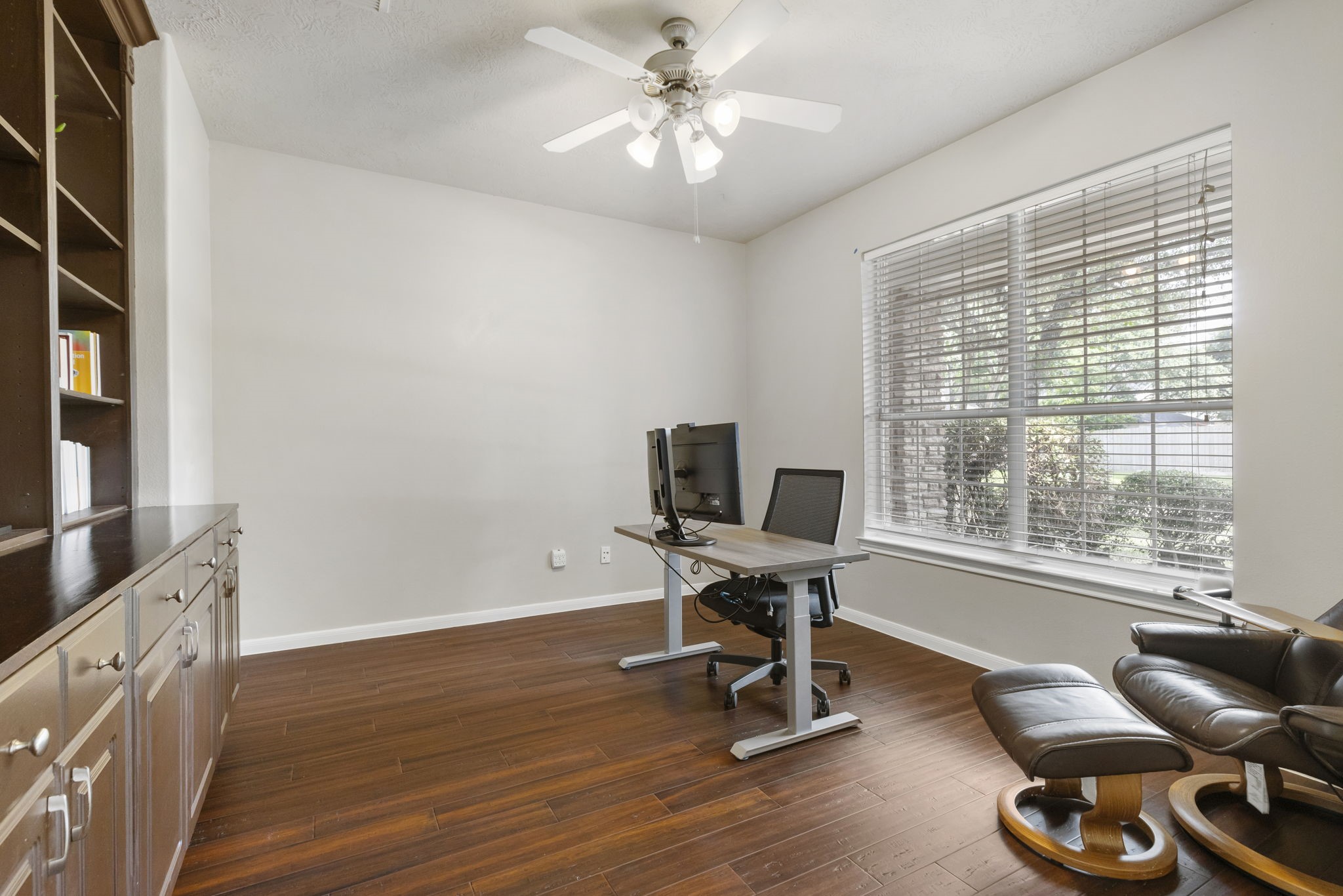 Conveniently located just off the entryway, the private study features French doors and custom built-ins, creating a quiet and functional work-from-home space.
