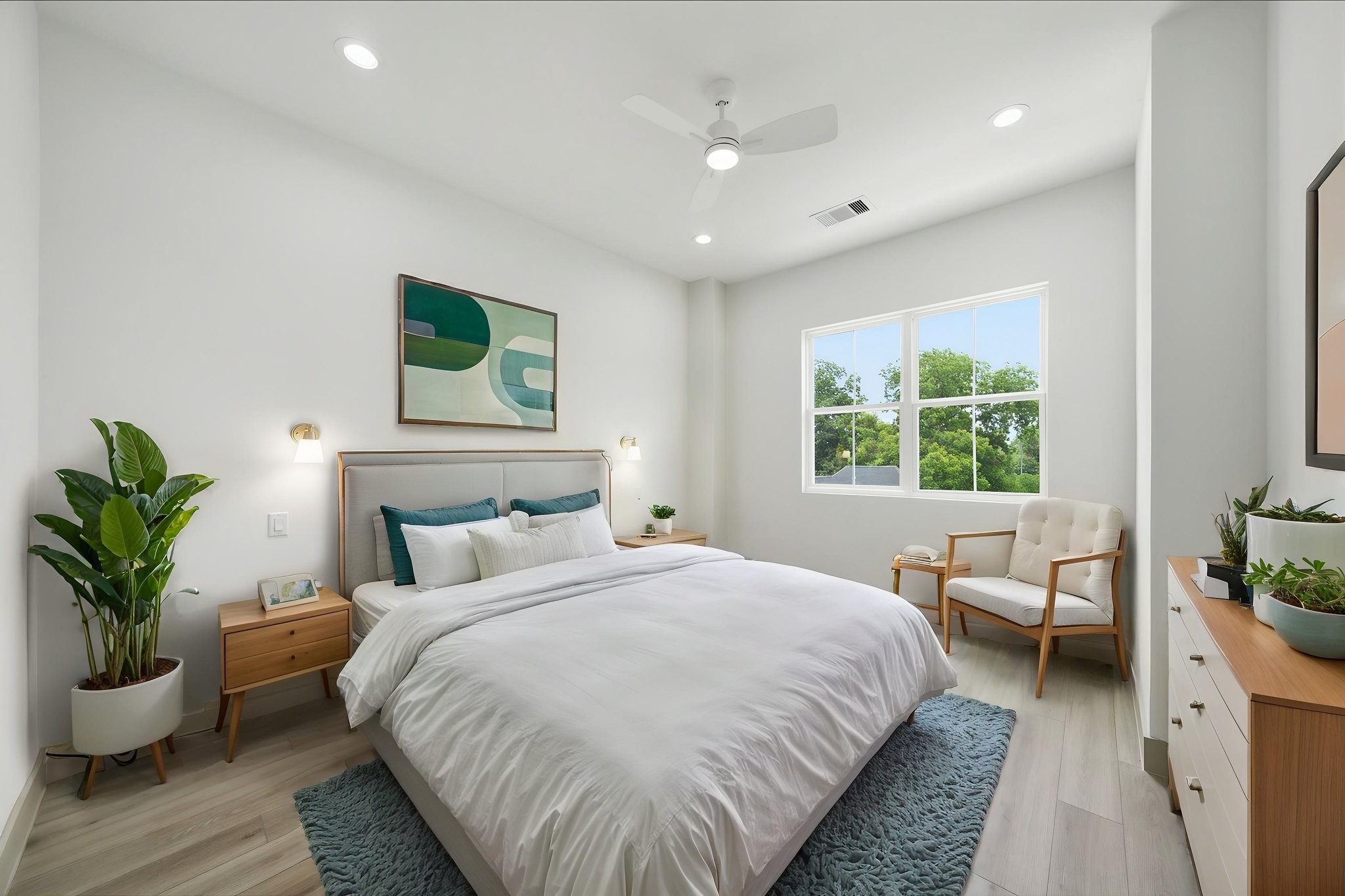 Virtually staged - Primary bedroom with tall 11' ceilings (and 11' throughout the home!). NO CARPET in this home! Note the bedside sconces pre-wired by the headboard!
