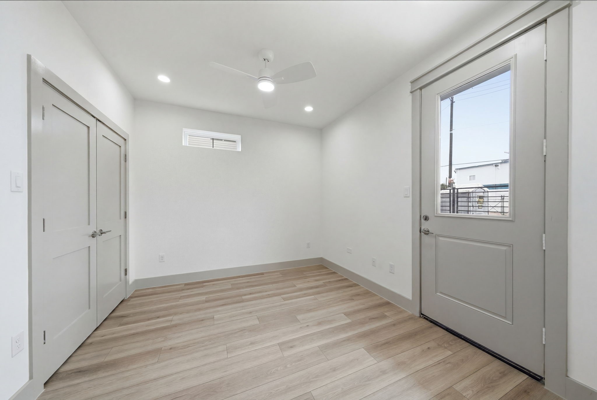 Guest bedroom on the 1st floor w door/access to yard! Double door closet on the left. Use this space as an office, workout space or another guest bedroom!