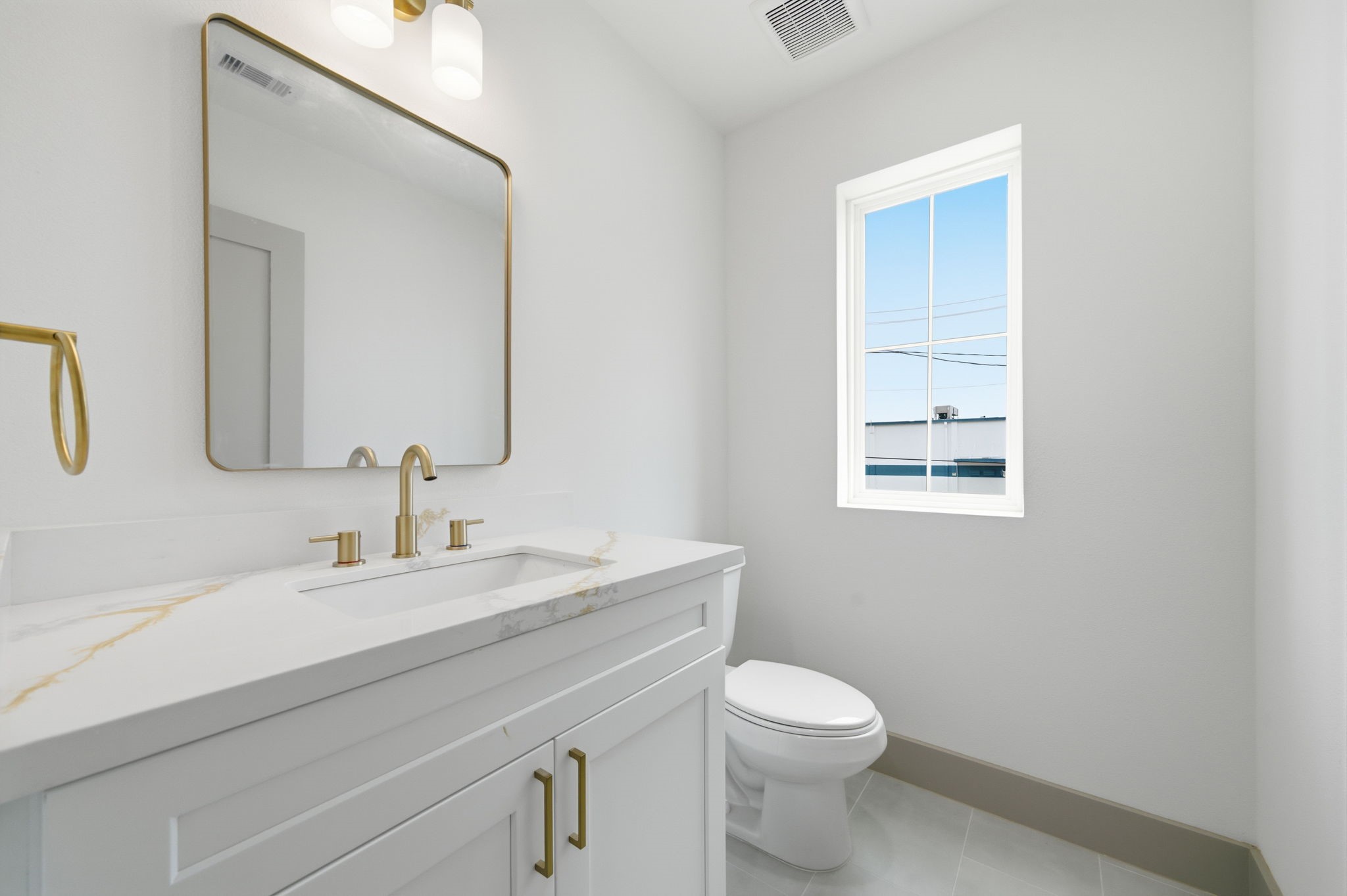 The half bath is close by to the entertainment space, yet provides plenty of privacy