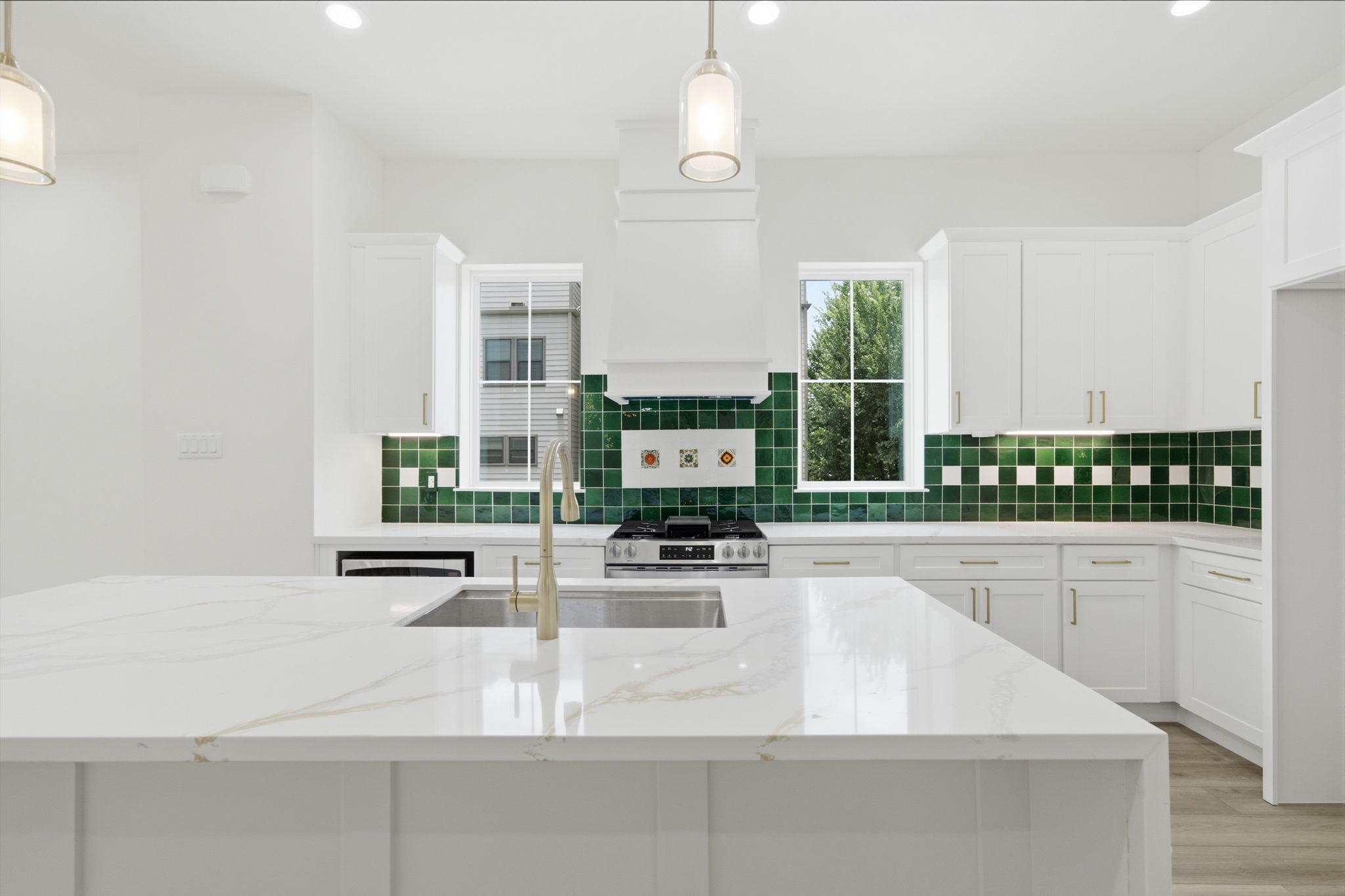 Double windows in the Kitchen letting in plenty of natural light. Being on a corner lot, these windows do not have any neighbors blocking the light!