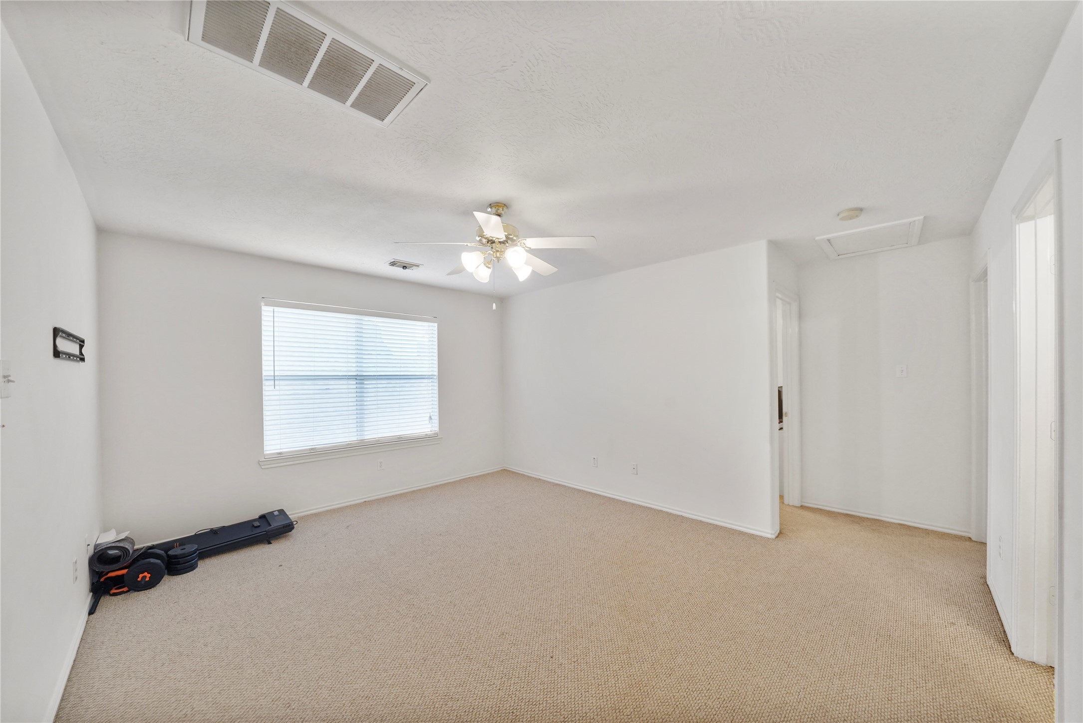 The upstairs game room creates a true second living area, ready for movie nights, hobbies, homework, or a relaxed lounge away from the main level.
