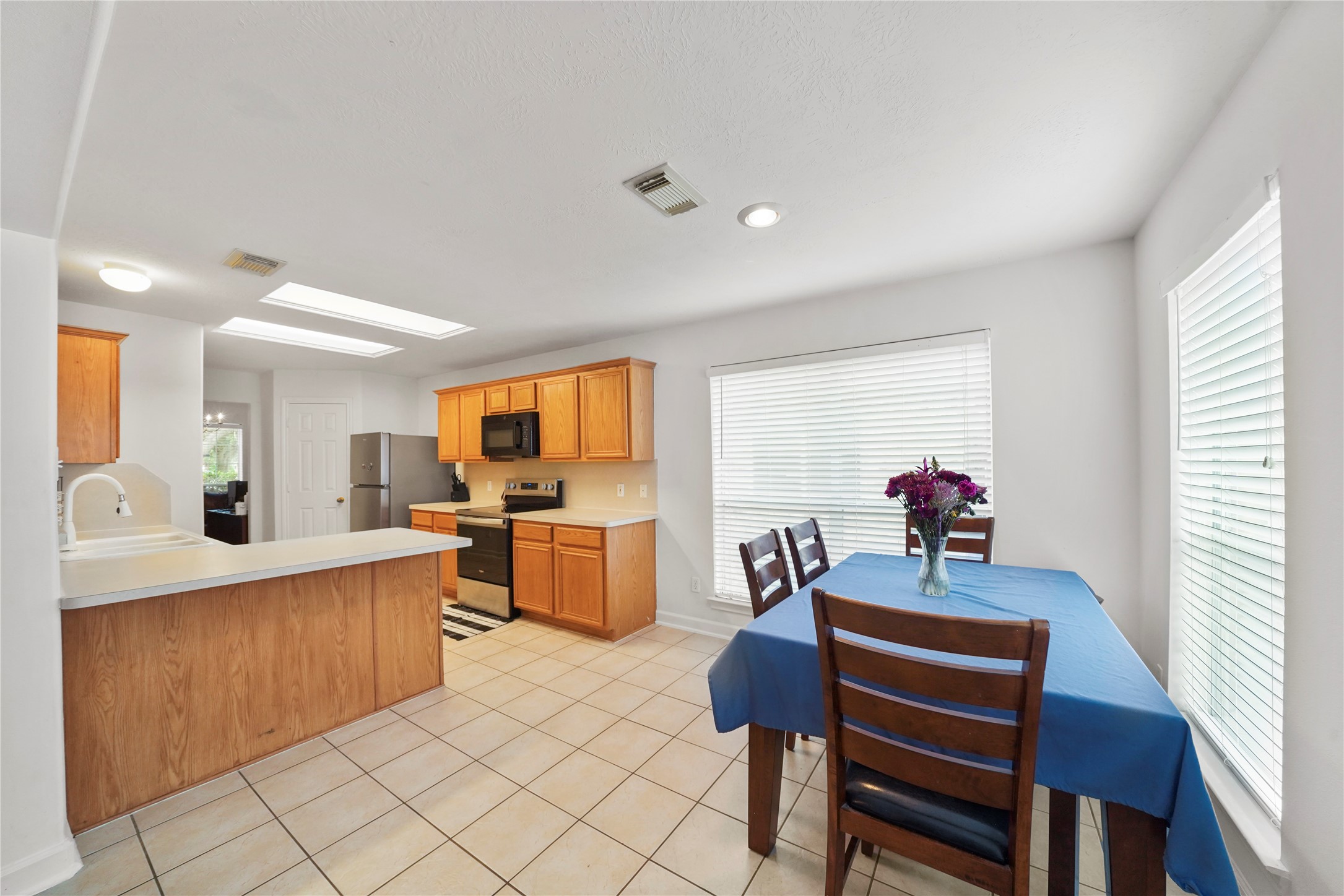 The breakfast area sits just off the kitchen, creating a cheerful spot for daily meals with a bright windowed backdrop. The breakfast area sits just off the kitchen, creating a cheerful spot for daily meals with a bright windowed backdrop.