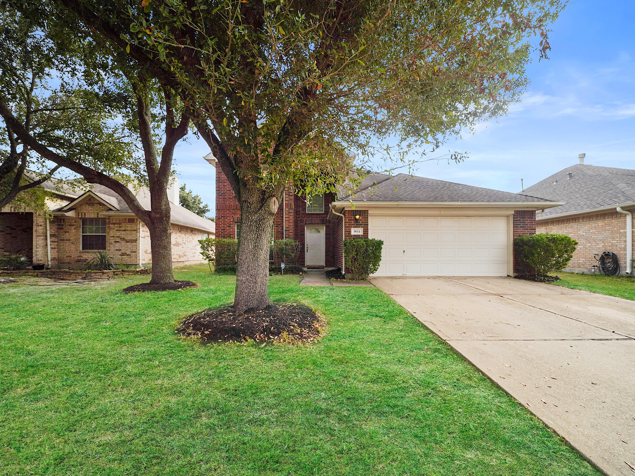 One final look at the curb appeal, paired with fresh paint, roof maintenance completed in October 2026, and updated AC components: attic unit replaced in August 2025 and exterior condenser in June 2026.