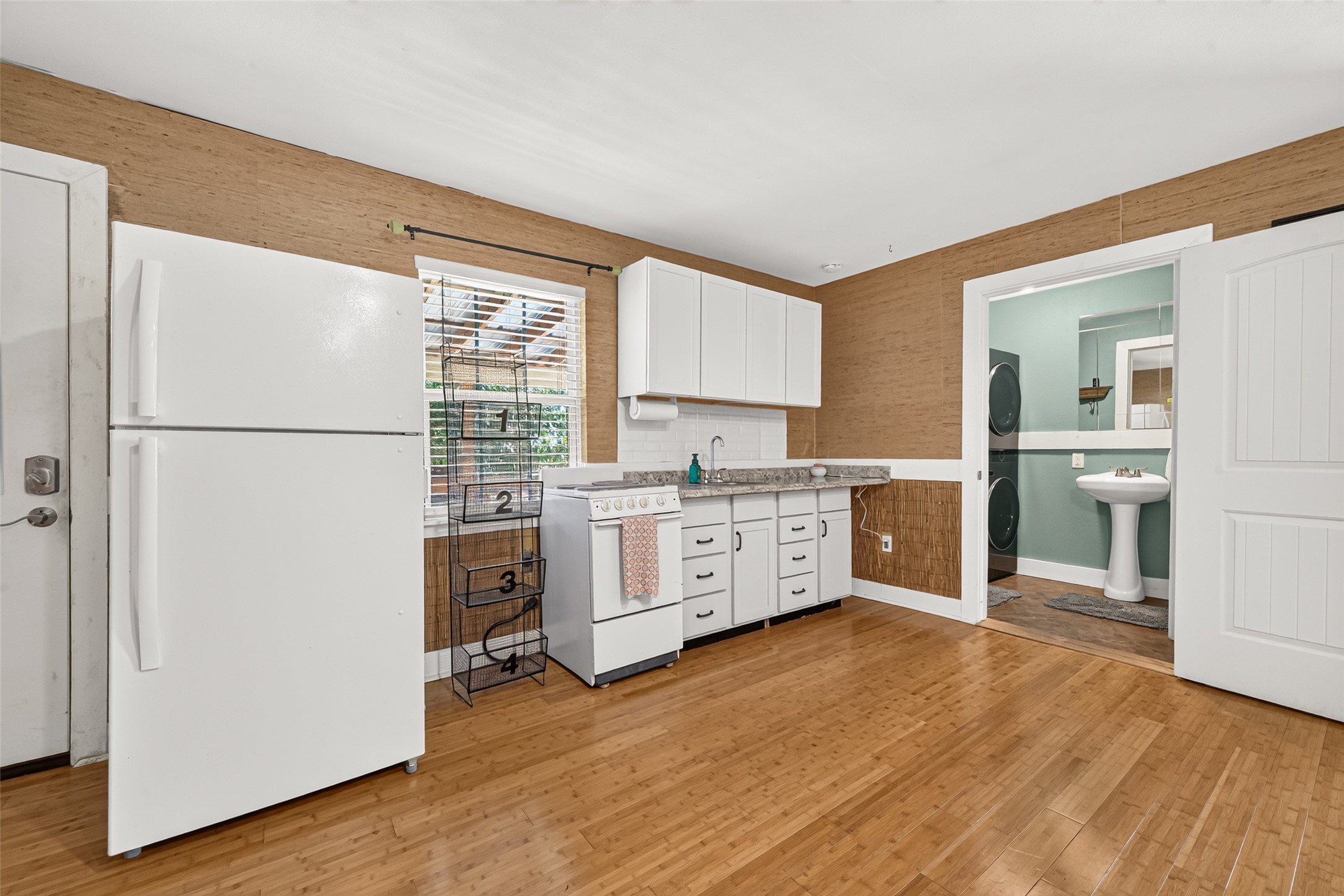 A KITCHENETTE WAS A RECENT ADDITION TO THE POOL HOUSE. THE ELECTRIC STOVE WILL REMAIN WITH HOME. A STAND UP SHOWER ALONG WITH WASHER & DRYER CONNECTIONS WERE ALSO ADDED. (EXCLUSIONS: REFRIGERATOR/WASHER/DRYER). 2" INCH FAUX BLINDS, CURTAIN RODS WILL REMAIN WITH HOME;
